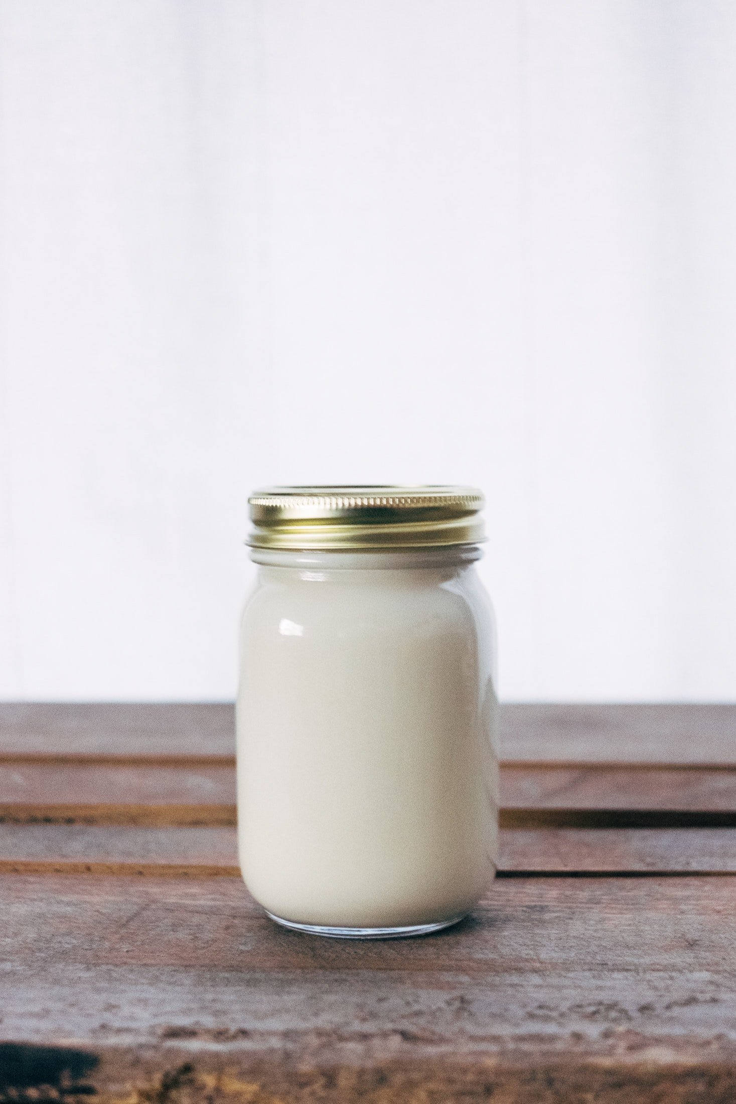 Pictured - A picture of a clear jar on the brown table | Source: Pexels 