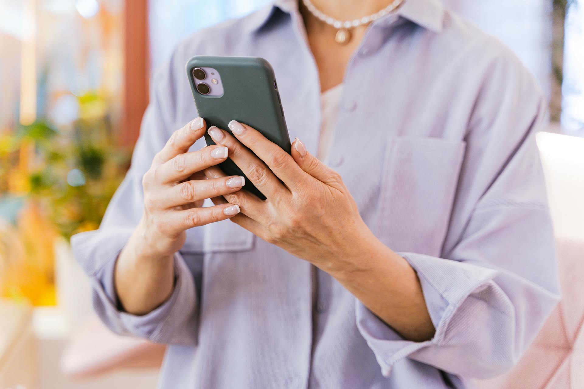 A woman using a phone | Source: Pexels