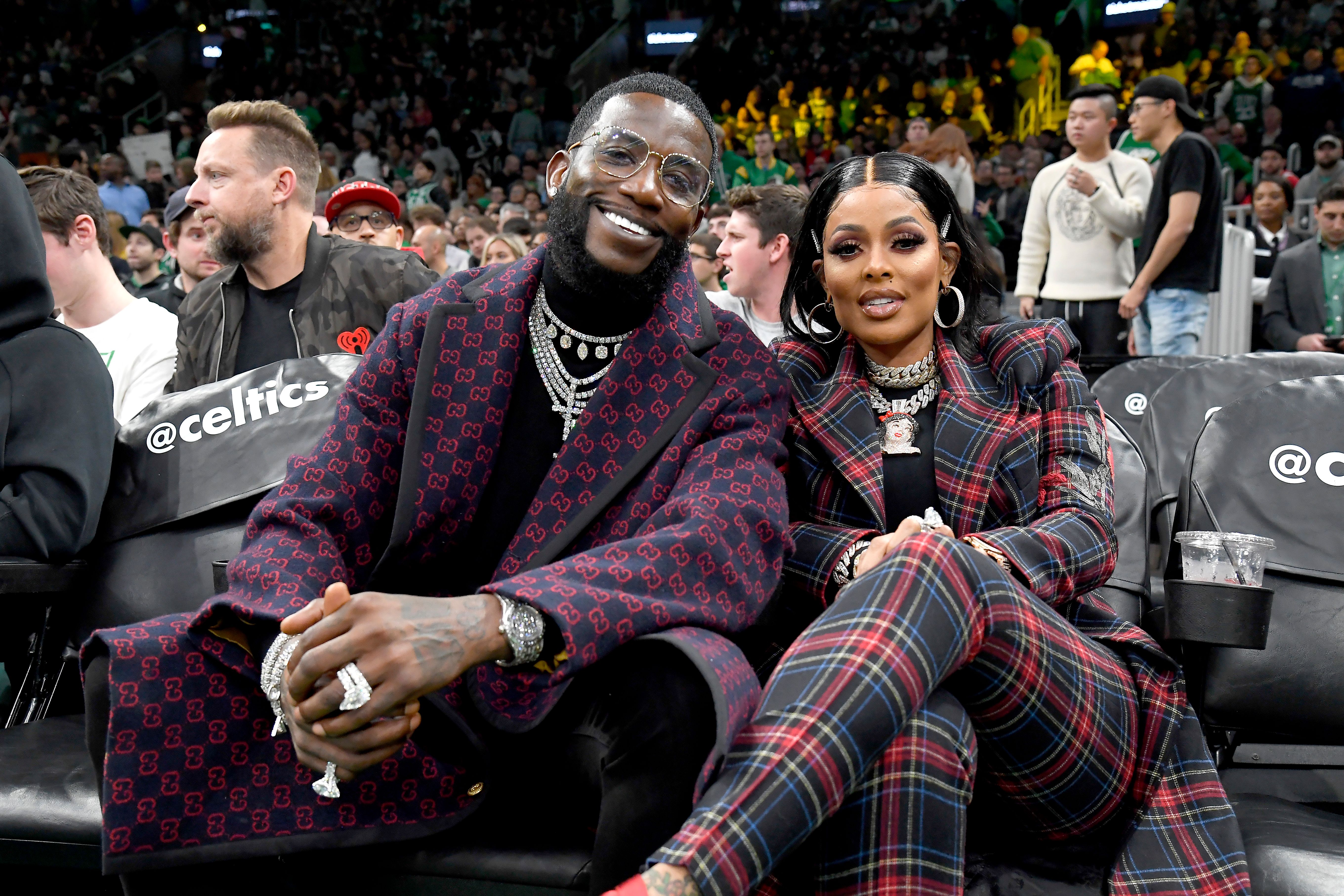 Stylish couple Gucci Mane and Keyshia Ka'oir watching the game between the Boston Celtics and the Brooklyn Nets on November 27, 2019 | Photo: Getty Images