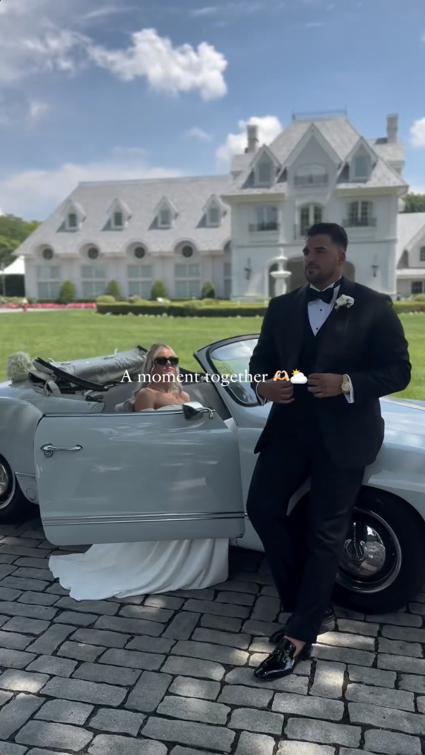 Victoria Schultz and Jon Runyan Jr. posing by a vintage car on their wedding day, posted on July 10, 2024 | Source: Instagram/antpagephoto, alenkafilms and victoriajrunyan