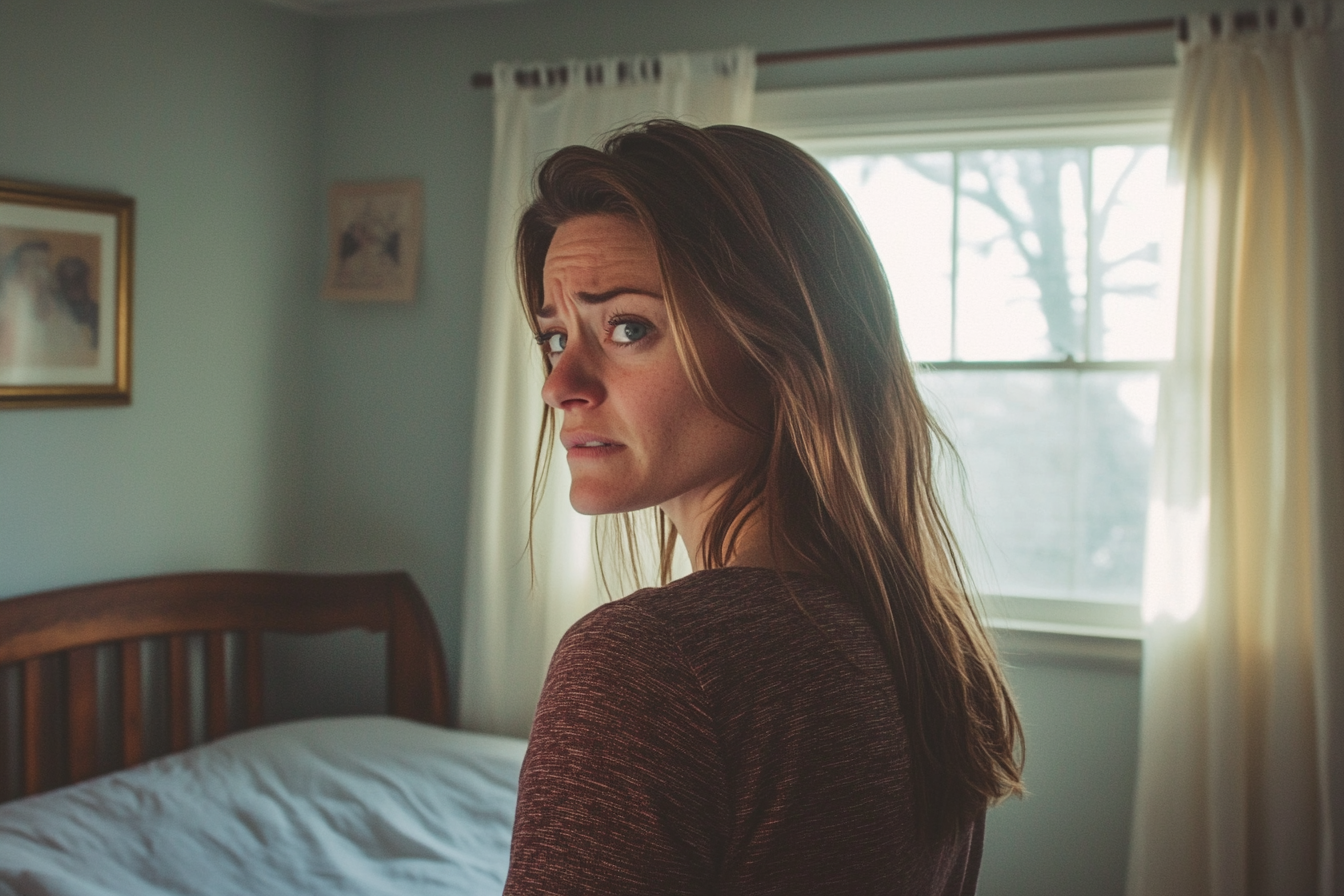 A woman in her son's empty bedroom | Source: Midjourney