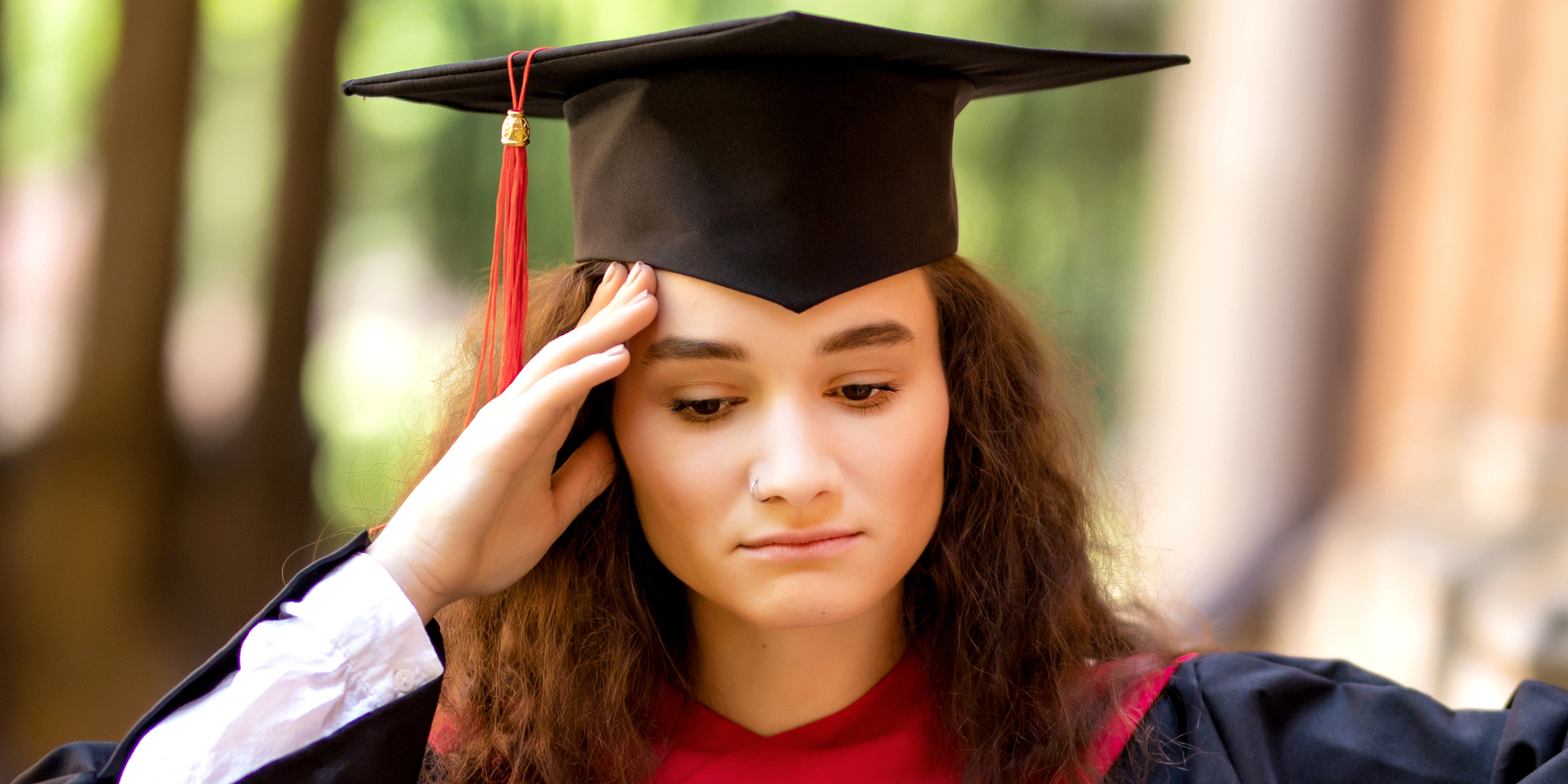 A young woman dressed for graduation | Source: Shutterstock