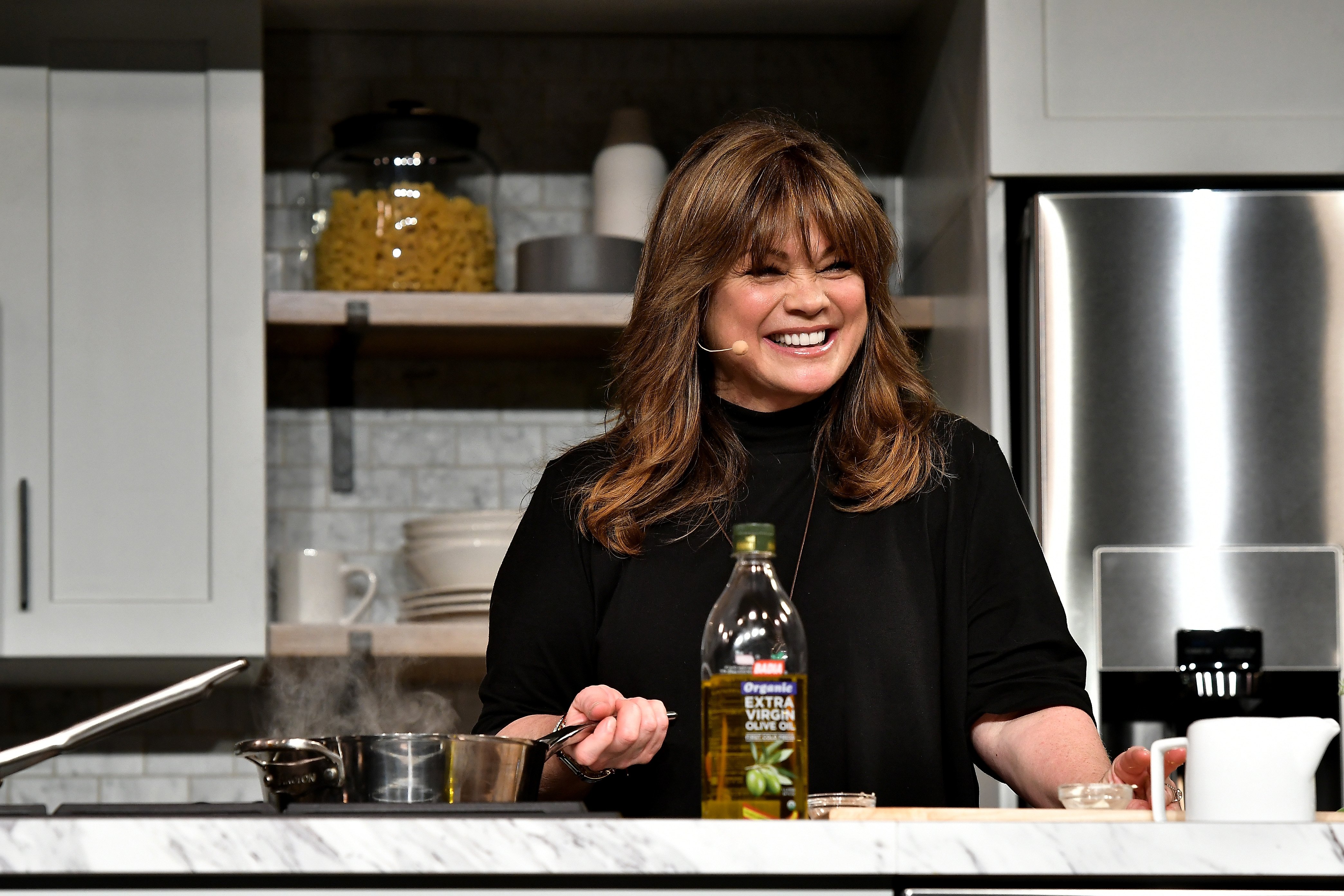 Valerie Bertinelli prepares a dish at the Food Network & Cooking Channel New York City Wine & Food Festival Presented By Coca-Cola - Grand Tasting presented by ShopRite featuring Samsung® Culinary Demonstrations presented by Mastercard at Pier 94 on October 15, 2017, in New York City. | Source: Getty Images