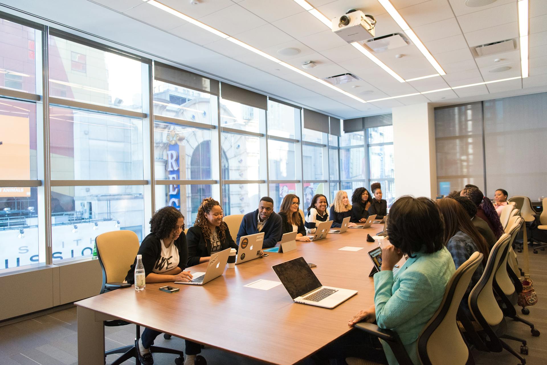 People seated at a conference table | Source: Pexels