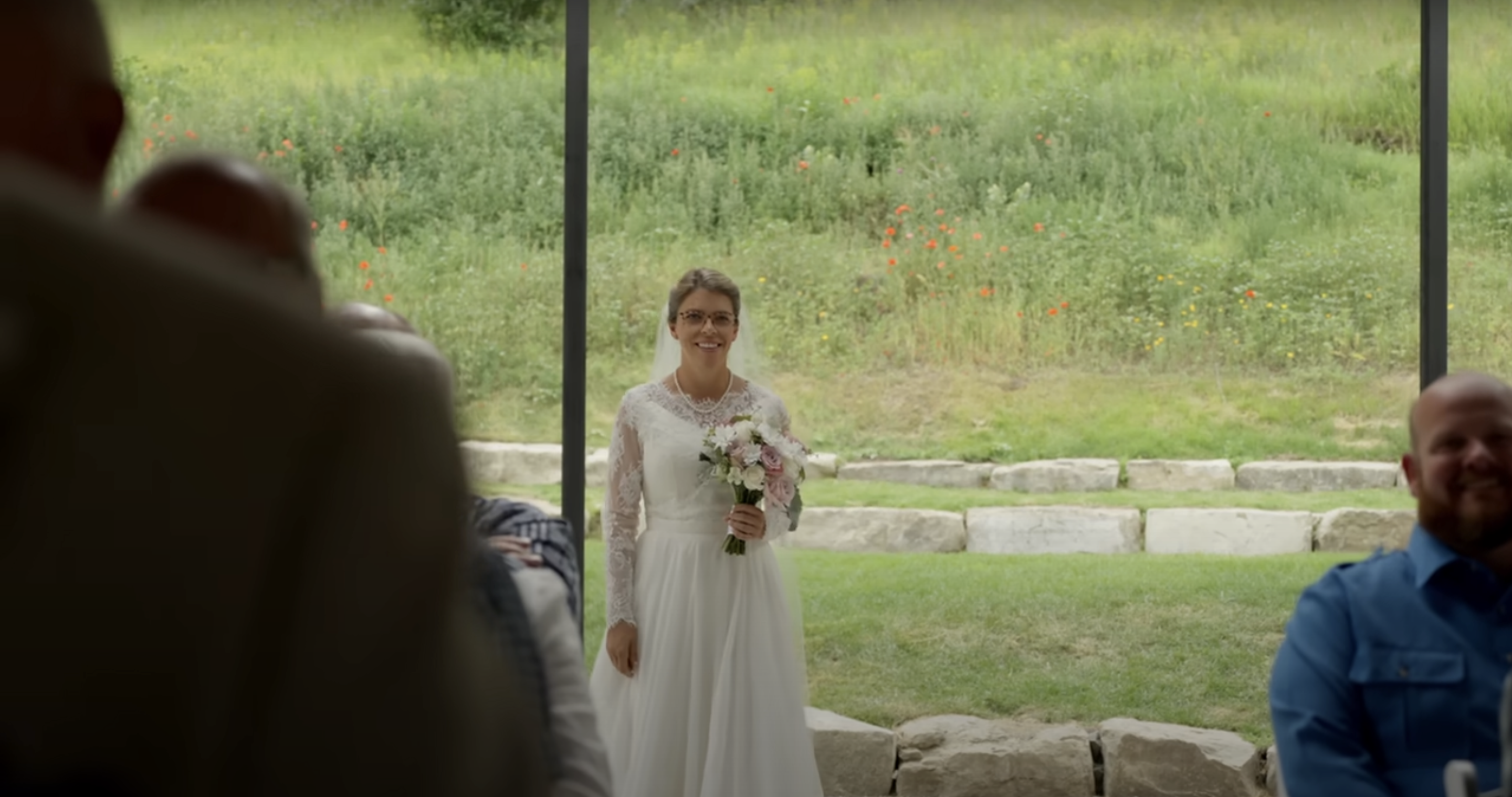 Rebecca walking down the aisle | Source: YouTube/@RoryFeek