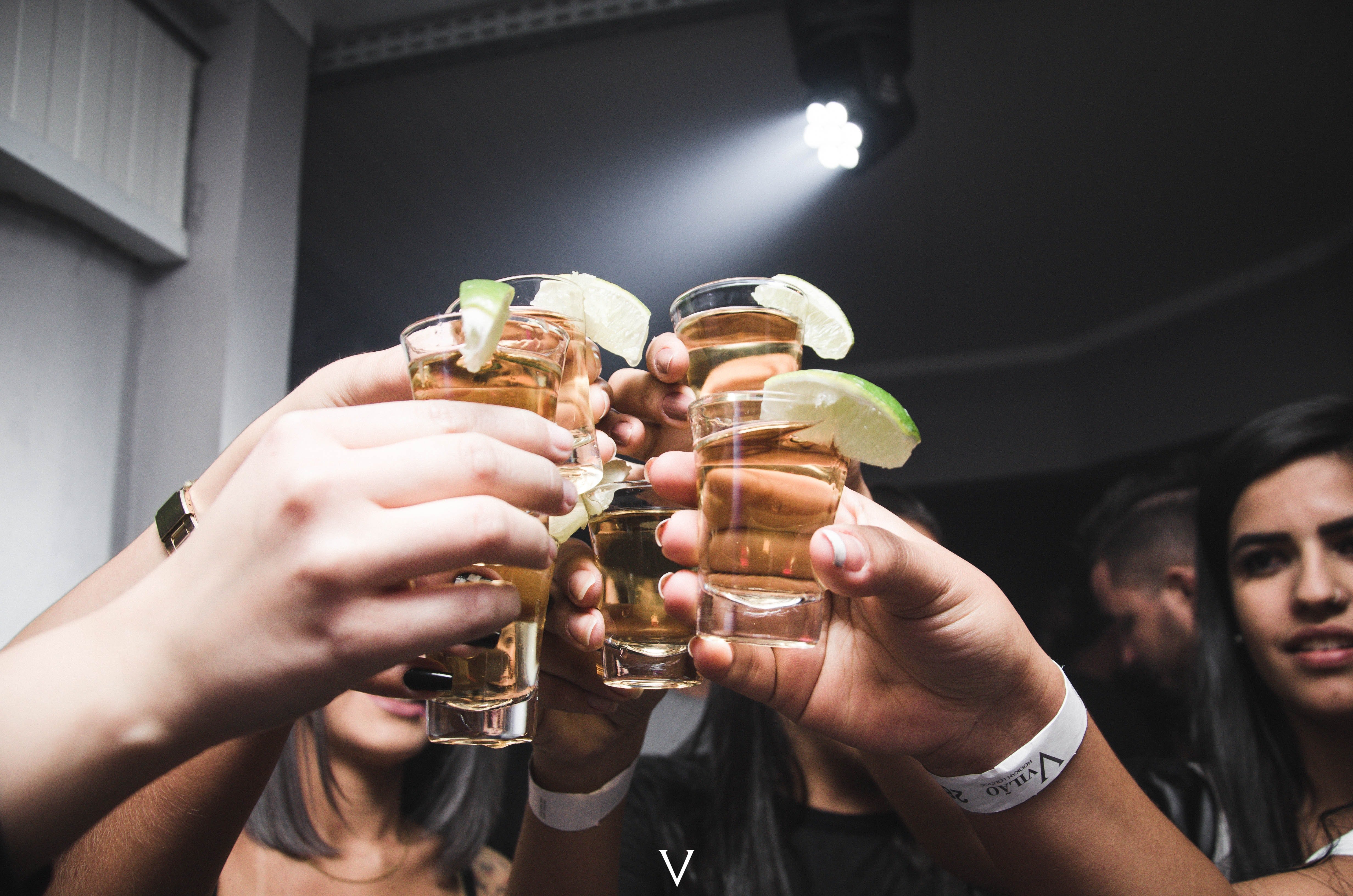 Tequila shots raised up. | Source: Pexel/ Isabella Mendes