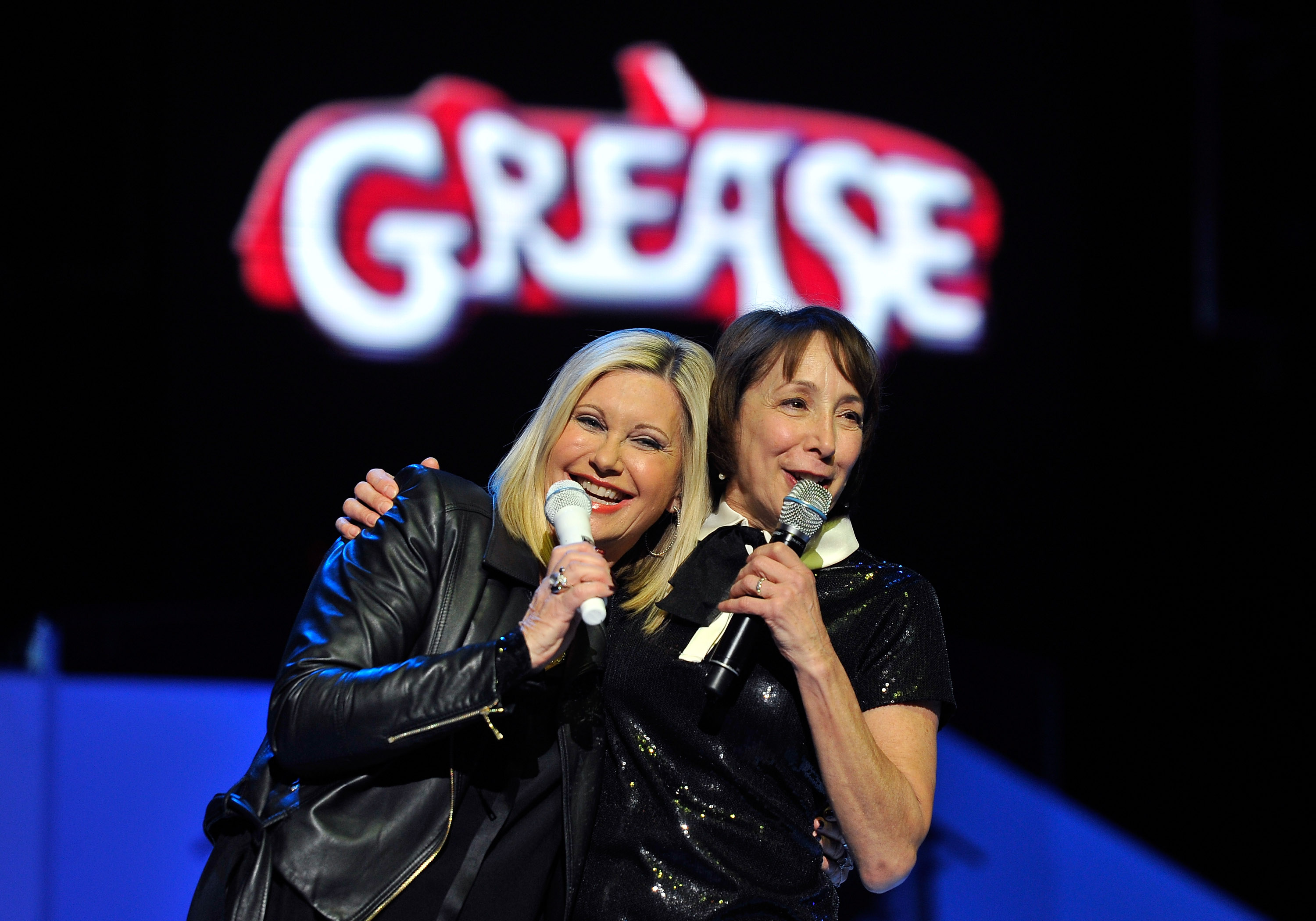 Olivia Newton-John and Didi Conn perform on stage on January 3, 2015, in Las Vegas, Nevada. | Source: Getty Images