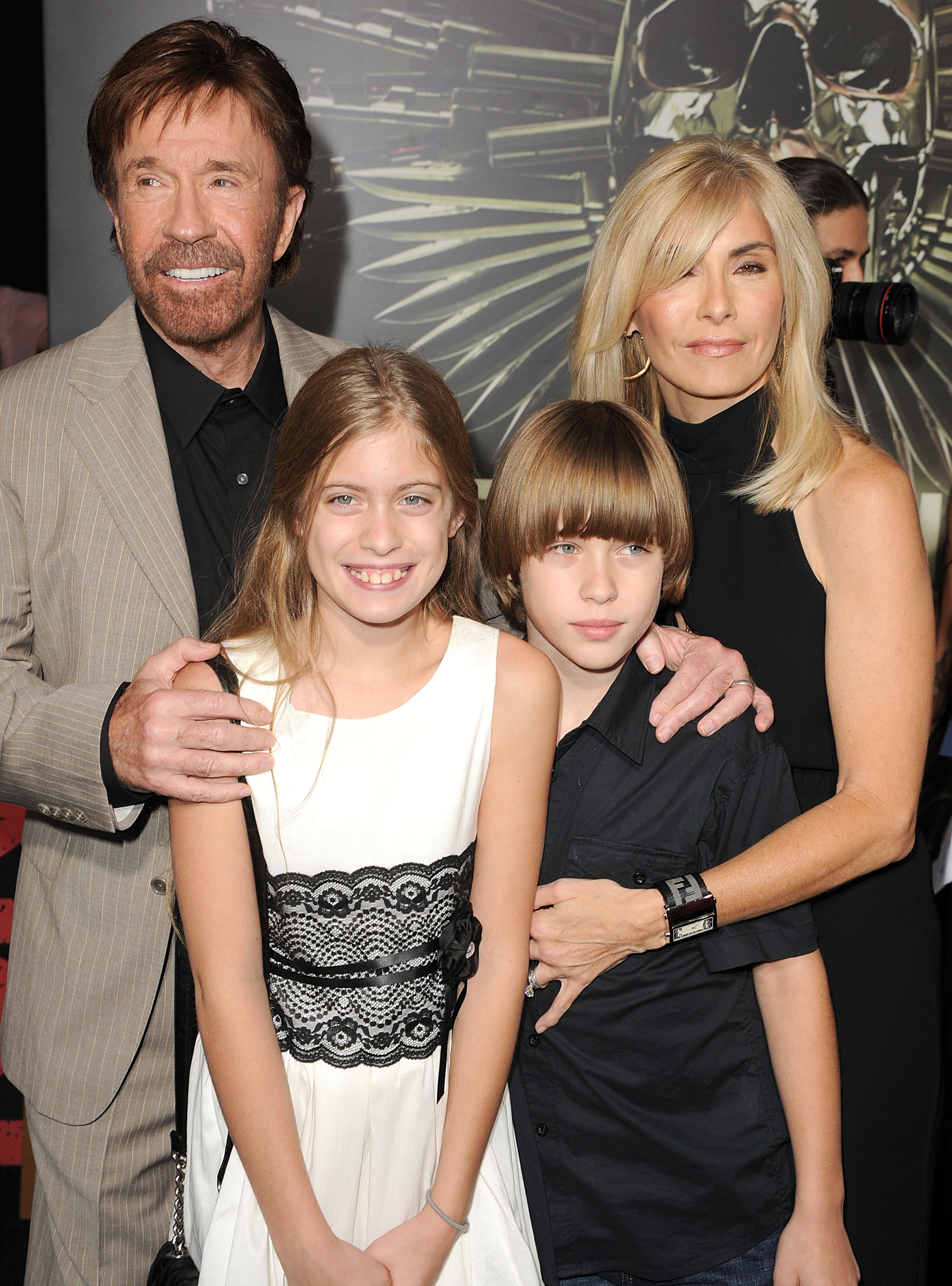 Chuck, Dakota, and Danilee Norris with Gena O'Kelley at "The Expendables 2" premiere in Los Angeles, 2012 | Source: Getty Images