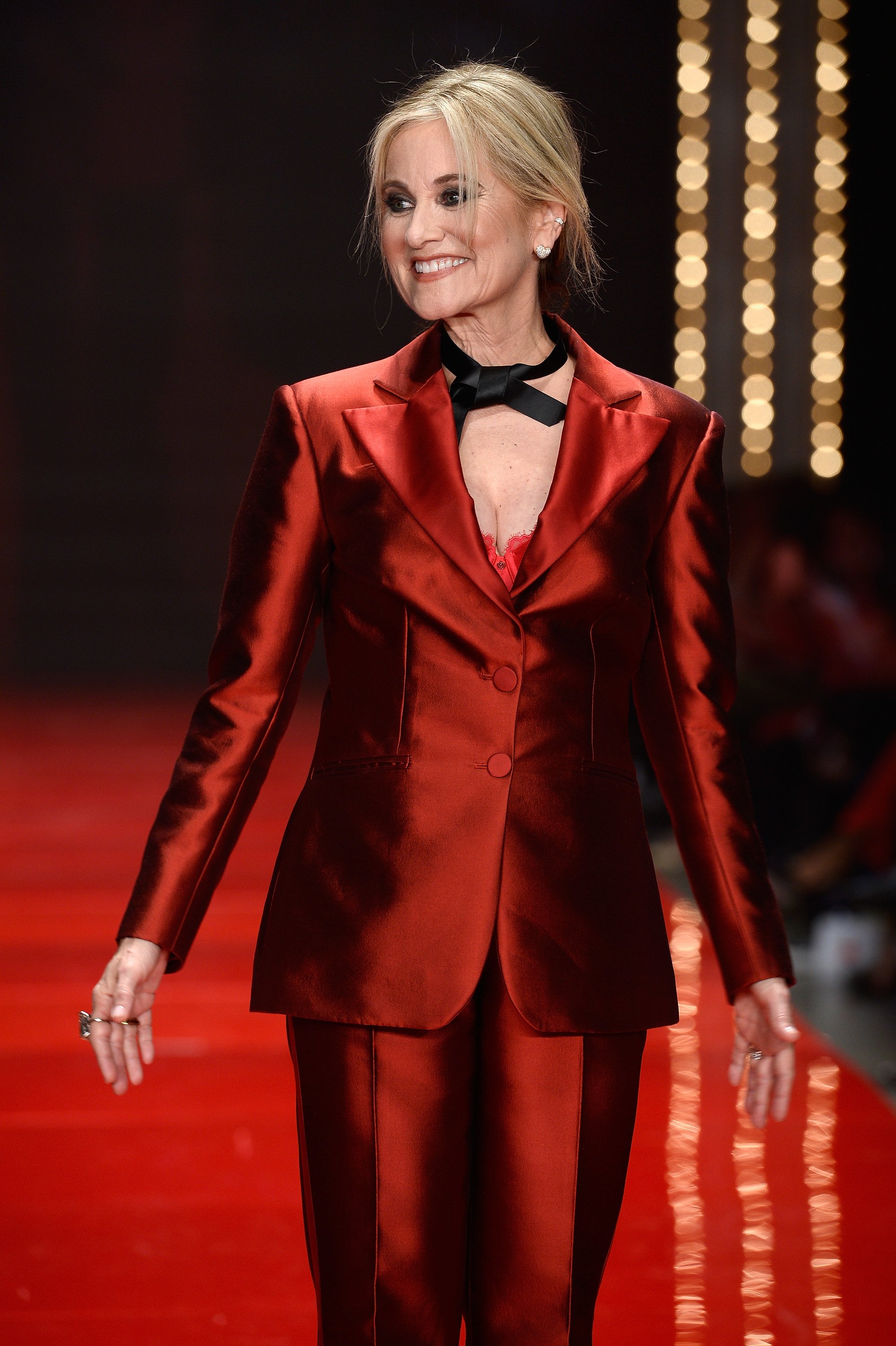 Maureen McCormick walks the runway at the American Heart Association's Go Red For Women Red Dress Collection 2017 presented by Macy's at Fashion Week in New York City at Hammerstein Ballroom on February 9, 2017 in New York City. | Source: Getty Images
