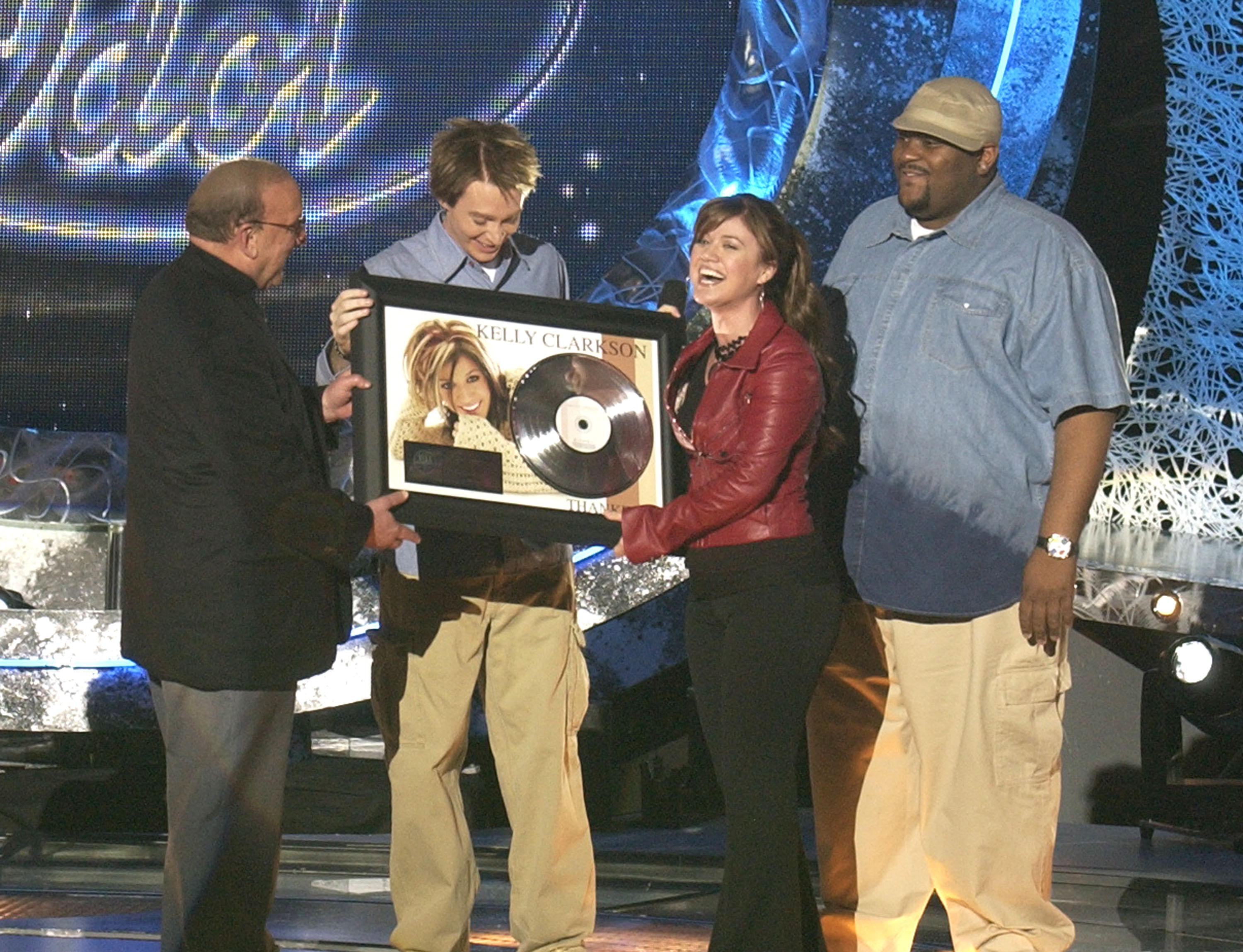 Clive Davis is pictured with Kelly Clarkson, Clay Aiken, and Ruben Studdard, whose careers flourished with his support following their success on "American Idol." | Source: Getty Images