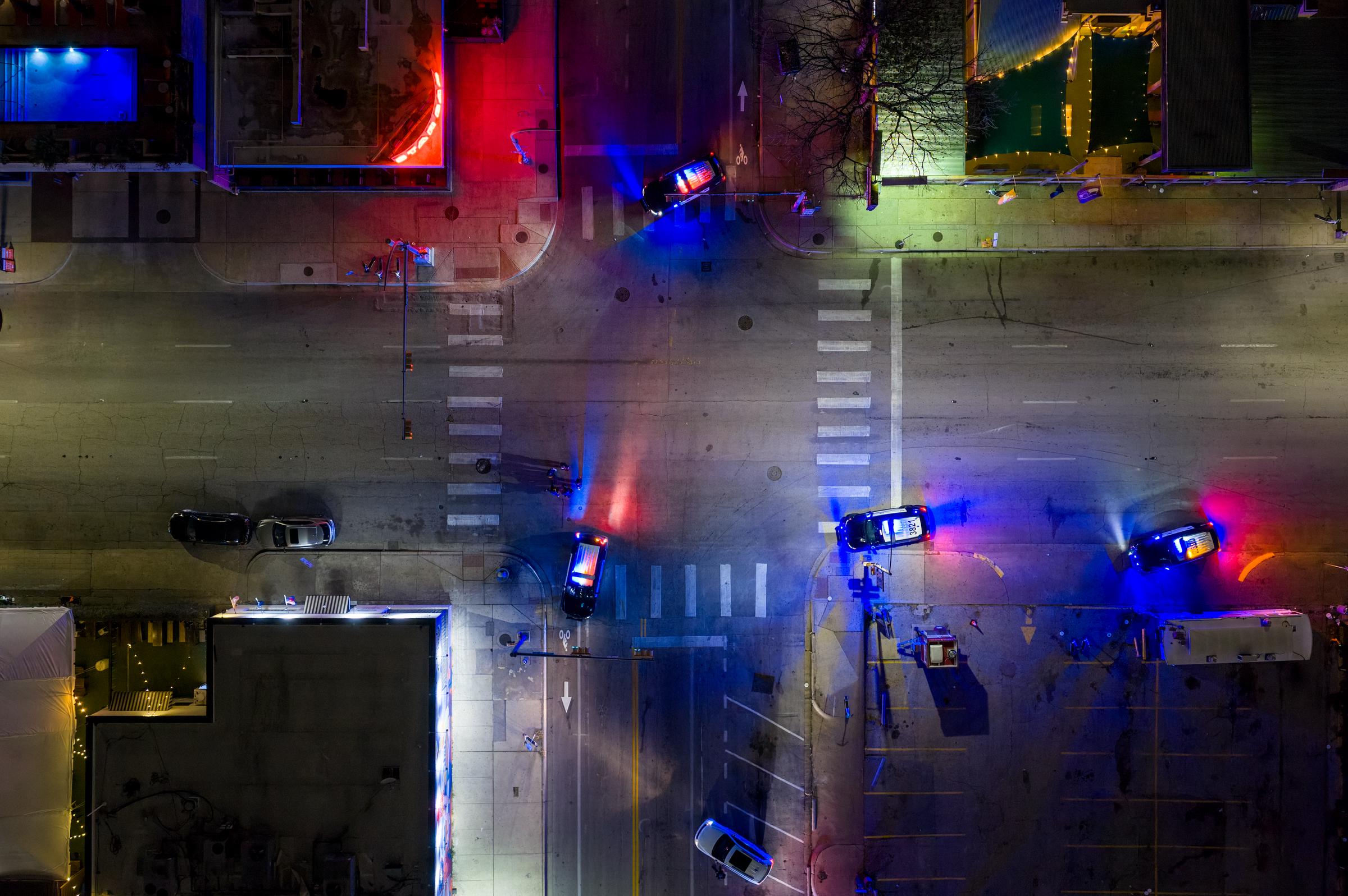 An aerial view shows law enforcement vehicles blocking an intersection near Buford’s bar in downtown Austin. | Source: Getty Images