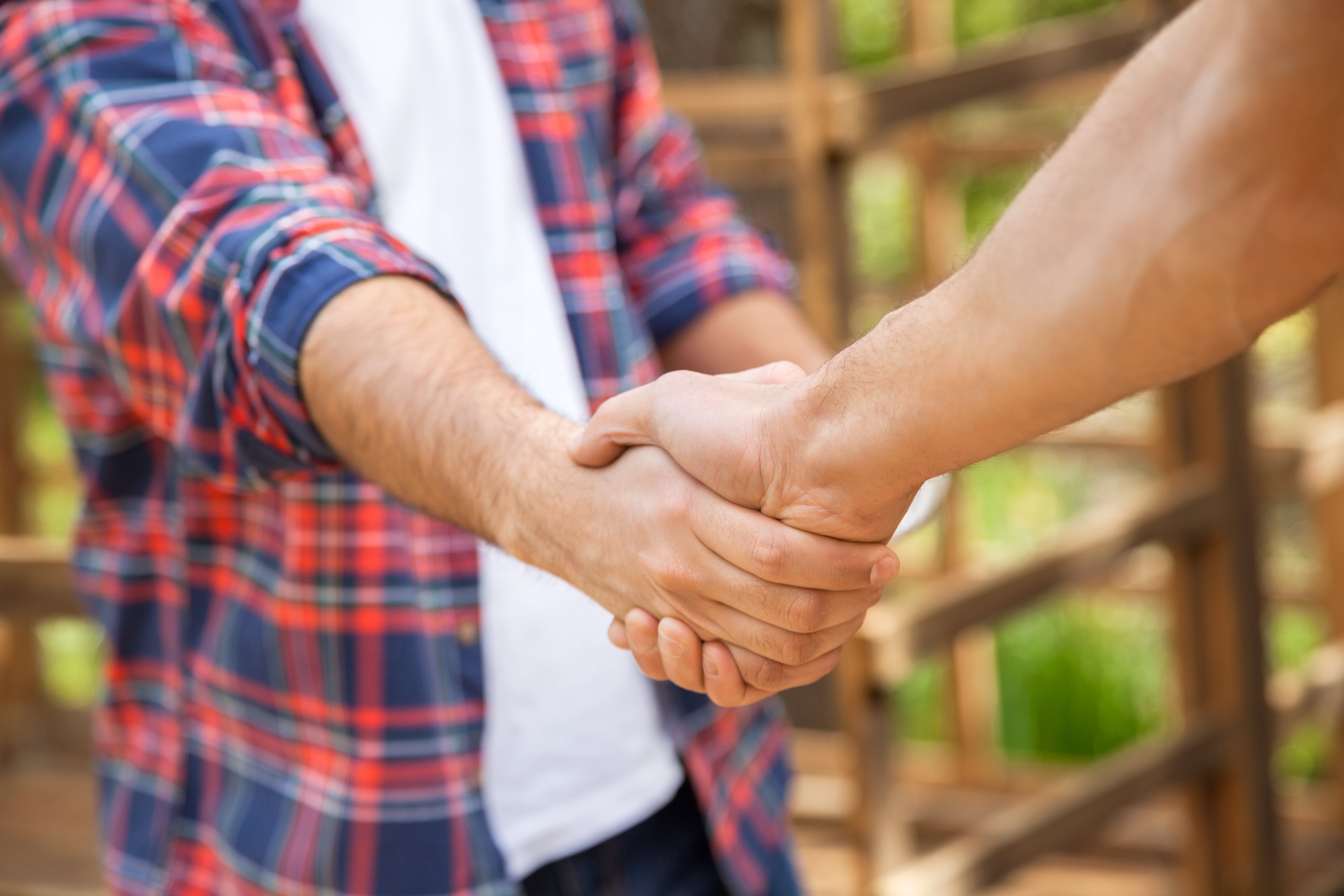 Two men shaking hands | Photo: Shutterstock