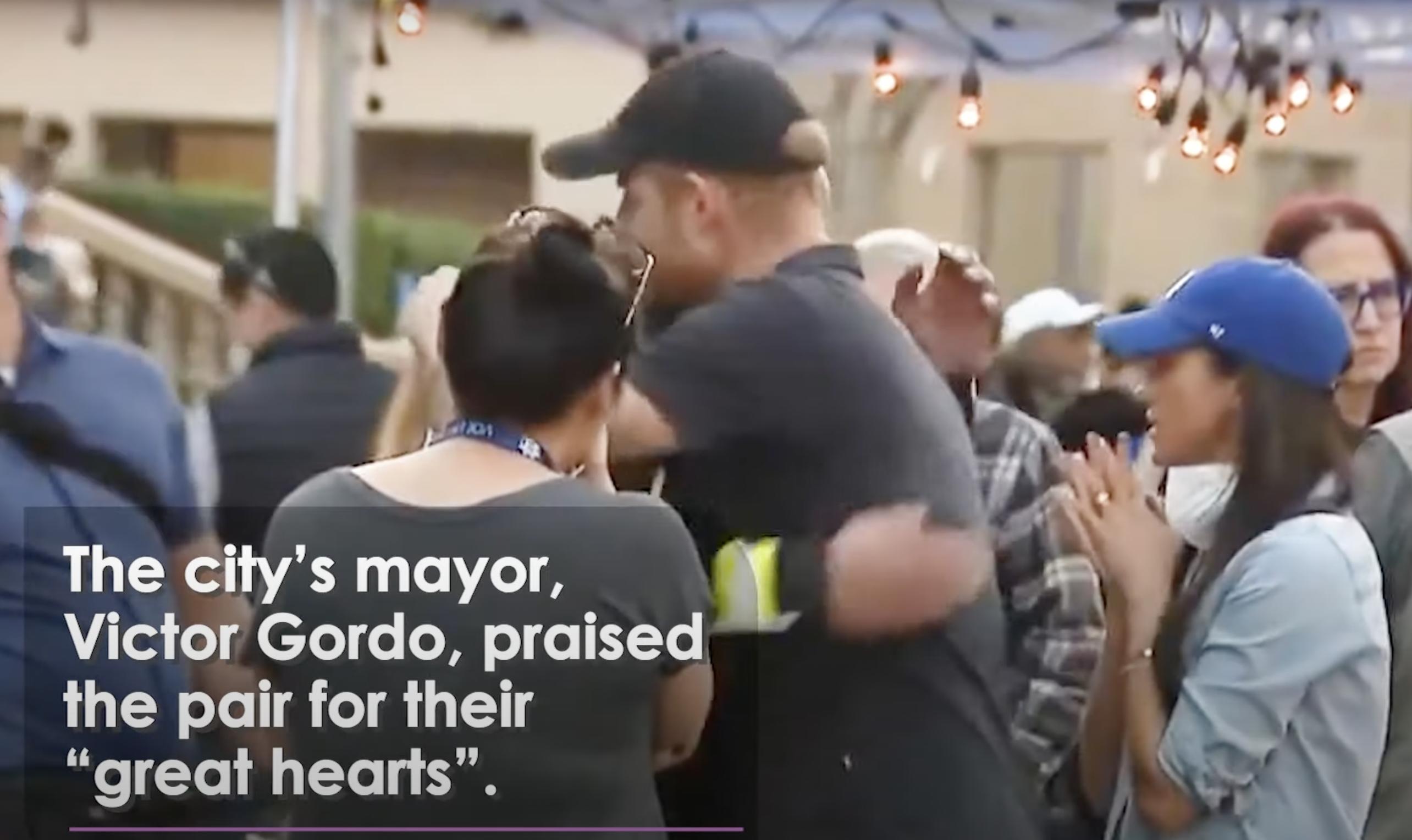 Prince Harry and Meghan Meghan pictured with residents following the wildfire | Source: YouTube/TheRoyalFamilyChannel