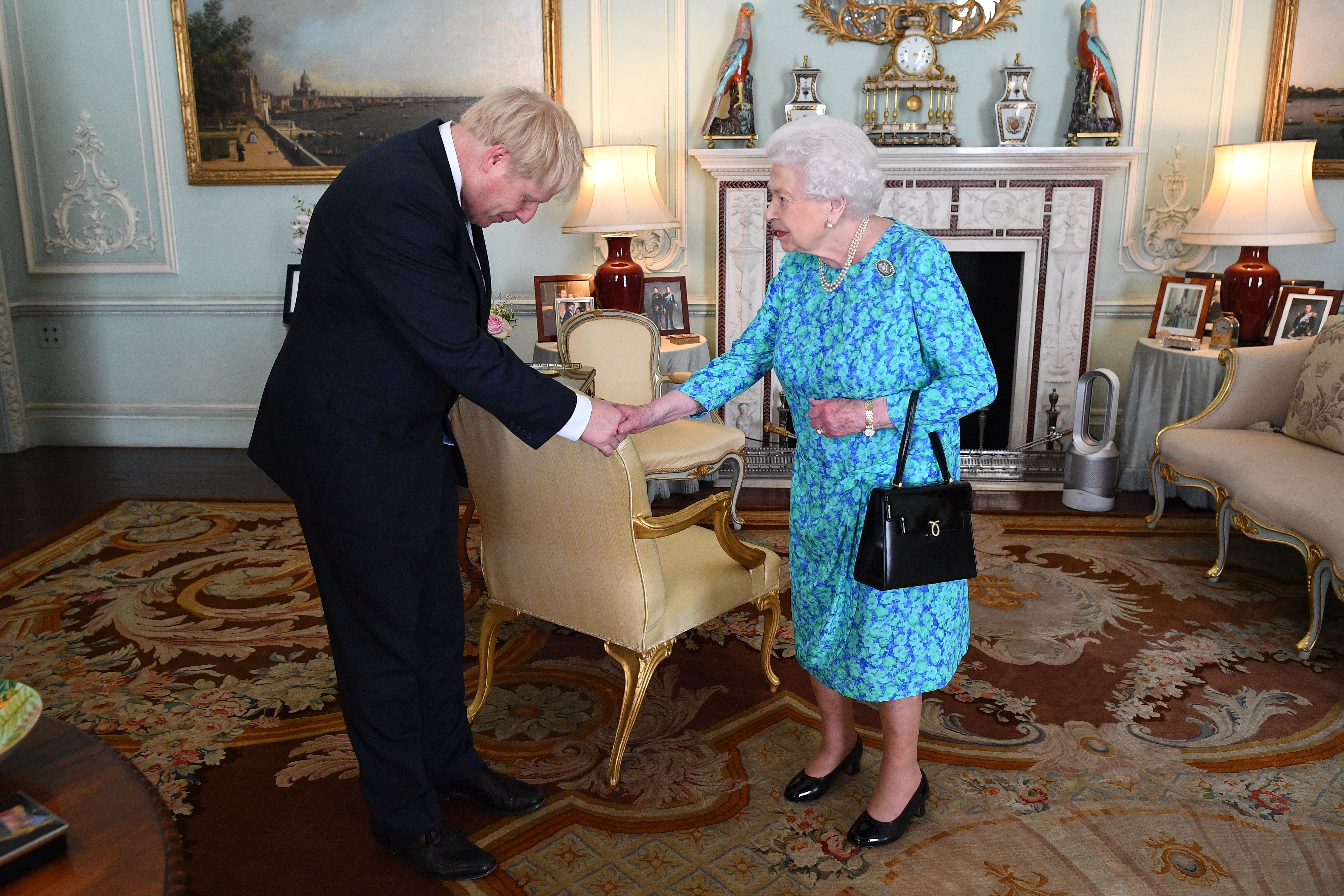 Queen Elizabeth II greets the Prime Minister of the United Kingdom, Boris Johnson in July 2019 | Photo: Getty Images