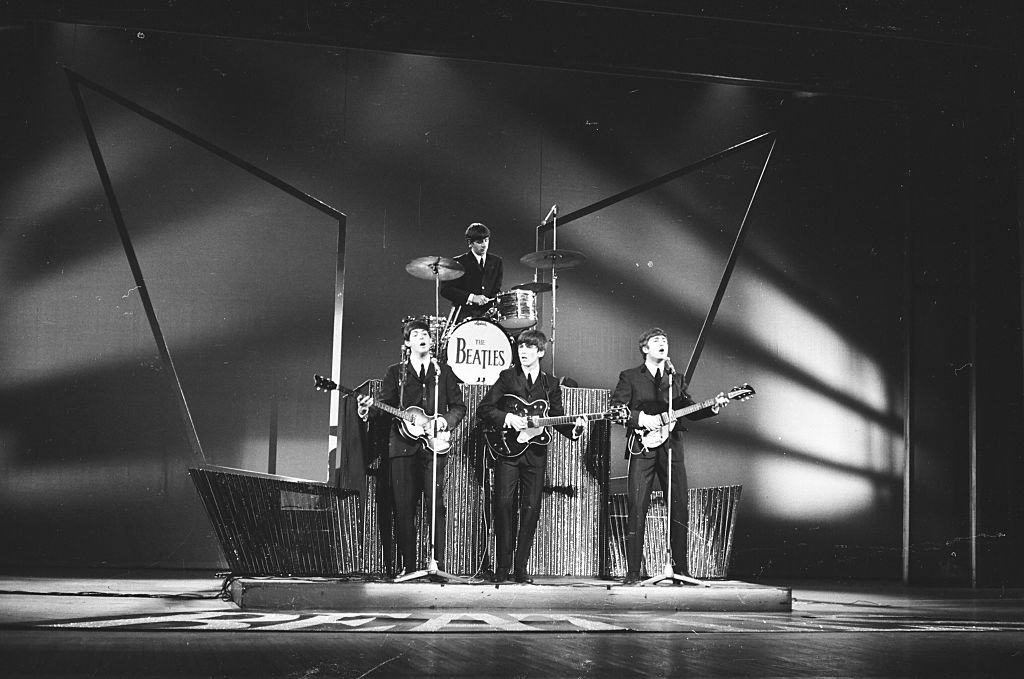 The Beatles perform on Sunday Night At The London Palladium, 13th October 1963. L-R Paul McCartney, Ringo Starr, George Harrison, John Lennon | Getty Images / Global Images Ukraine The Beatles perform on Sunday Night At The London Palladium, 13th October 1963. L-R Paul McCartney, Ringo Starr, George Harrison, John Lennon | Getty Images / Global Images Ukraine