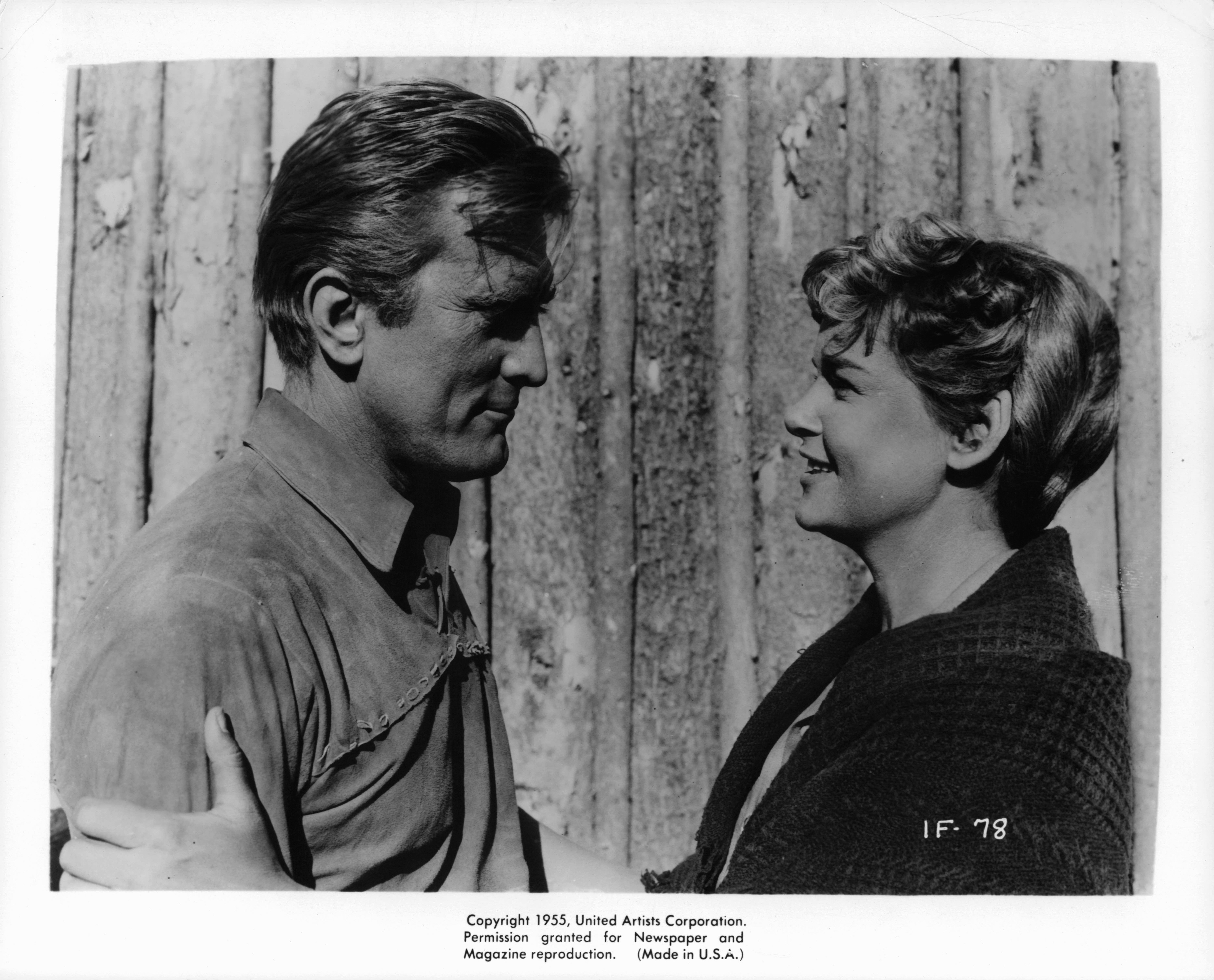 Kirk Douglas looks to Diana Douglas in a scene from the film "The Indian Fighter," circa 1955. | Photo: Getty Images