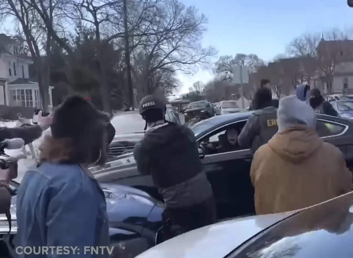 ICE Agents forcefully trying to get a woman out of her car from a video posted on January 14, 2026 | Source: YouTube/@NewsNation
