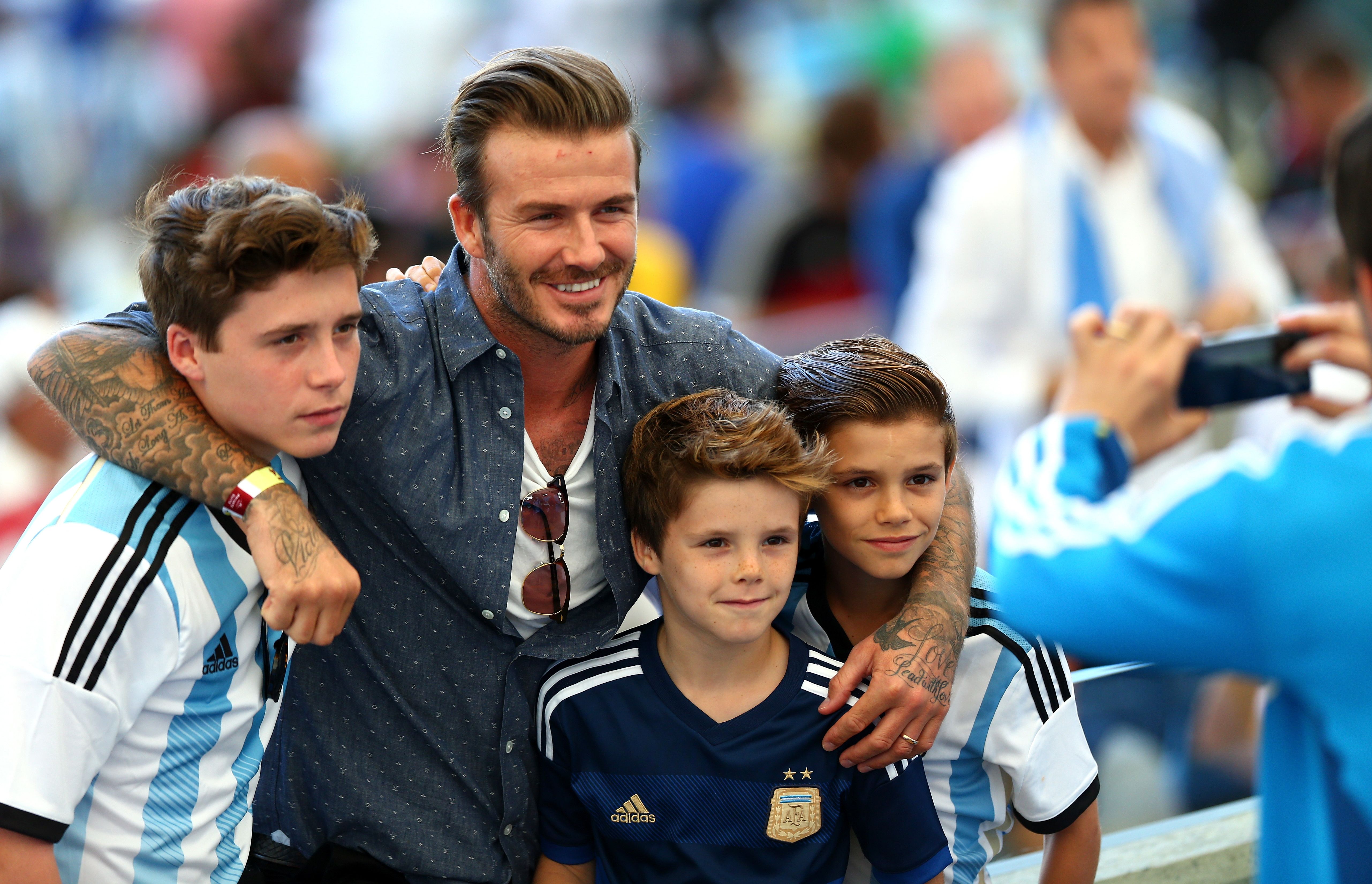 David Beckham and sons Brooklyn, Cruz, and Romeo at the 2014 FIFA World Cup Brazil Final match at Maracana on July 13, 2014 in Rio de Janeiro, Brazil. | Source: Getty Images