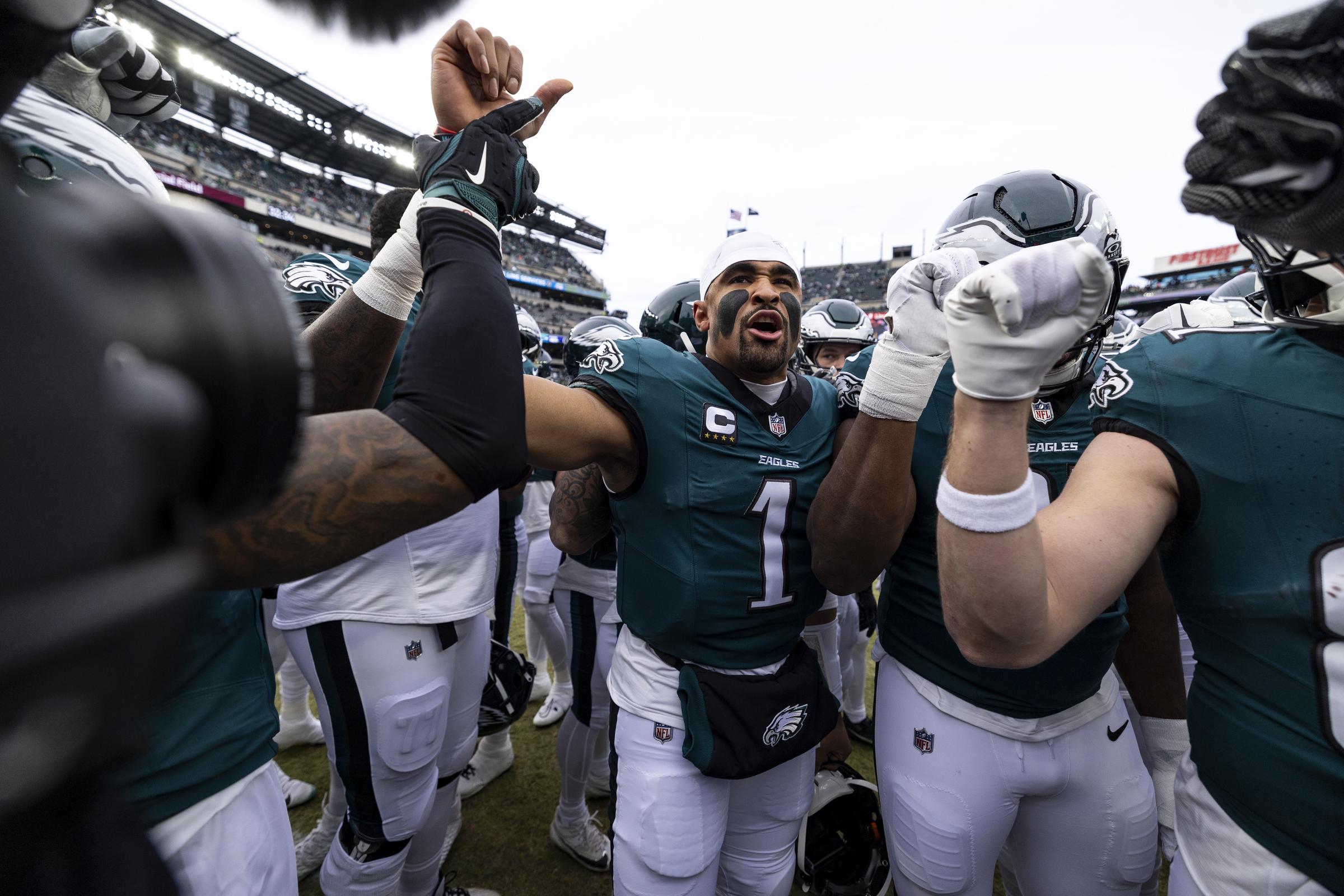 Jalen Hurts leading the Philadelphia Eagles in a huddle before the game. | Source: Getty Images