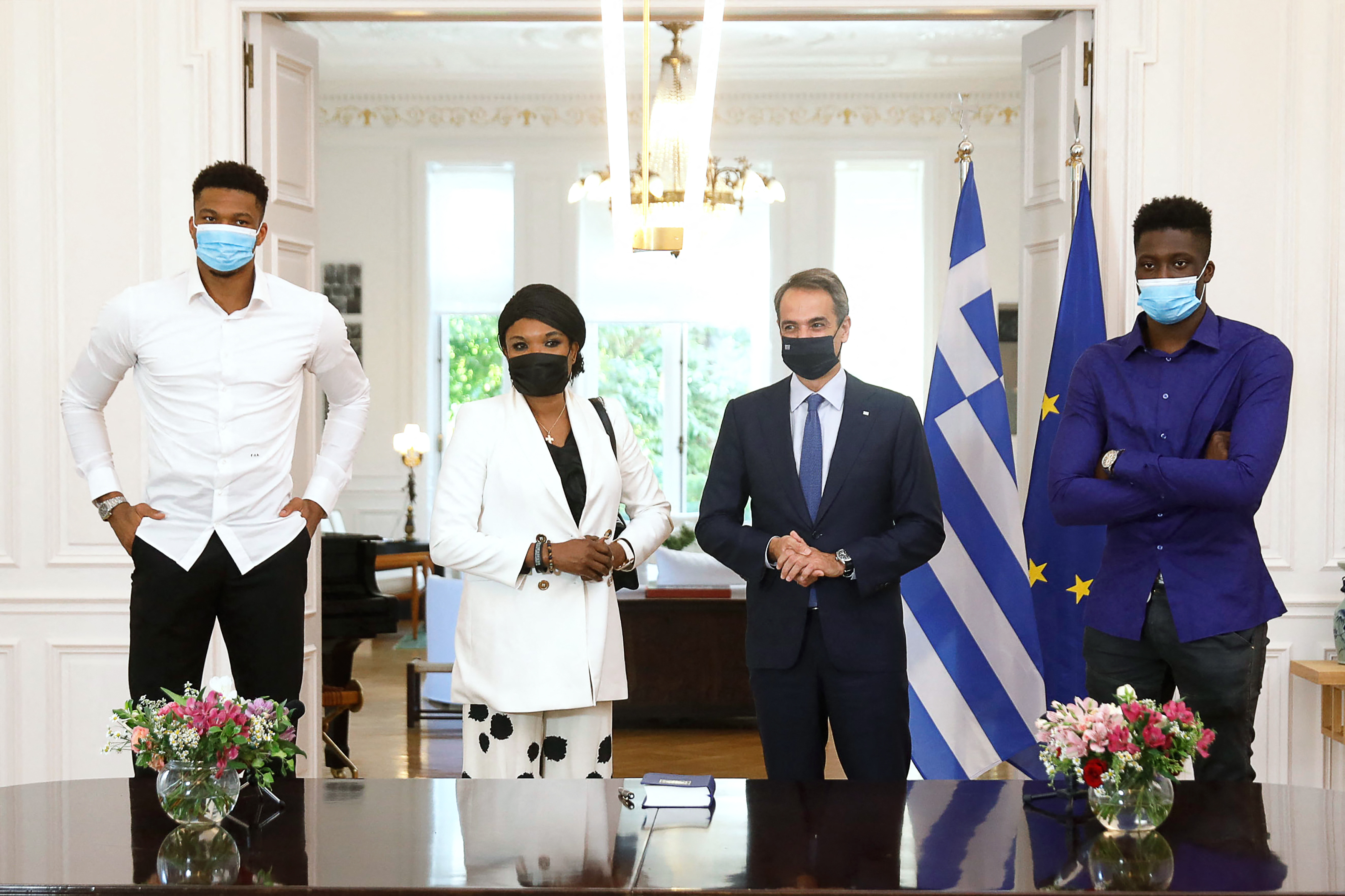 Greek Prime Minister Kyriakos Mitsotakis, Giannis Antetokounmpo, Veronica Antetokounmpo, and Alex Antetokounmpo after a naturalisation ceremony for Giannis' relatives at the Maximos Mansion in Athens, on September 16, 2021. | Source: Getty Images