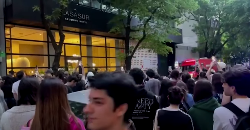 Fans gathered outside CasaSur Palermo Hotel, dated October 16, 2024 | Source: Youtube/Reuters