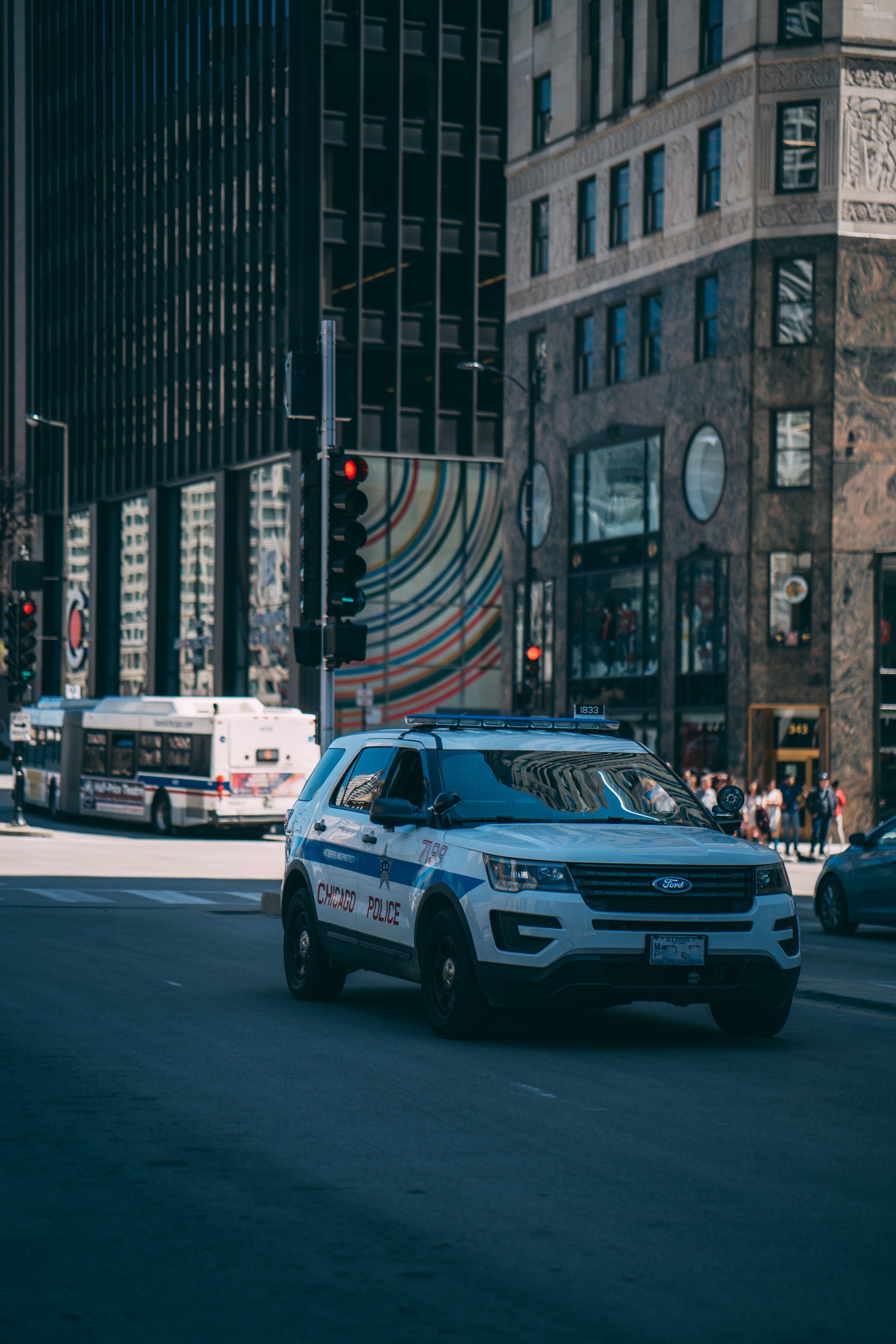 Pictured - A white police SUV passing by in the city | Pexels  