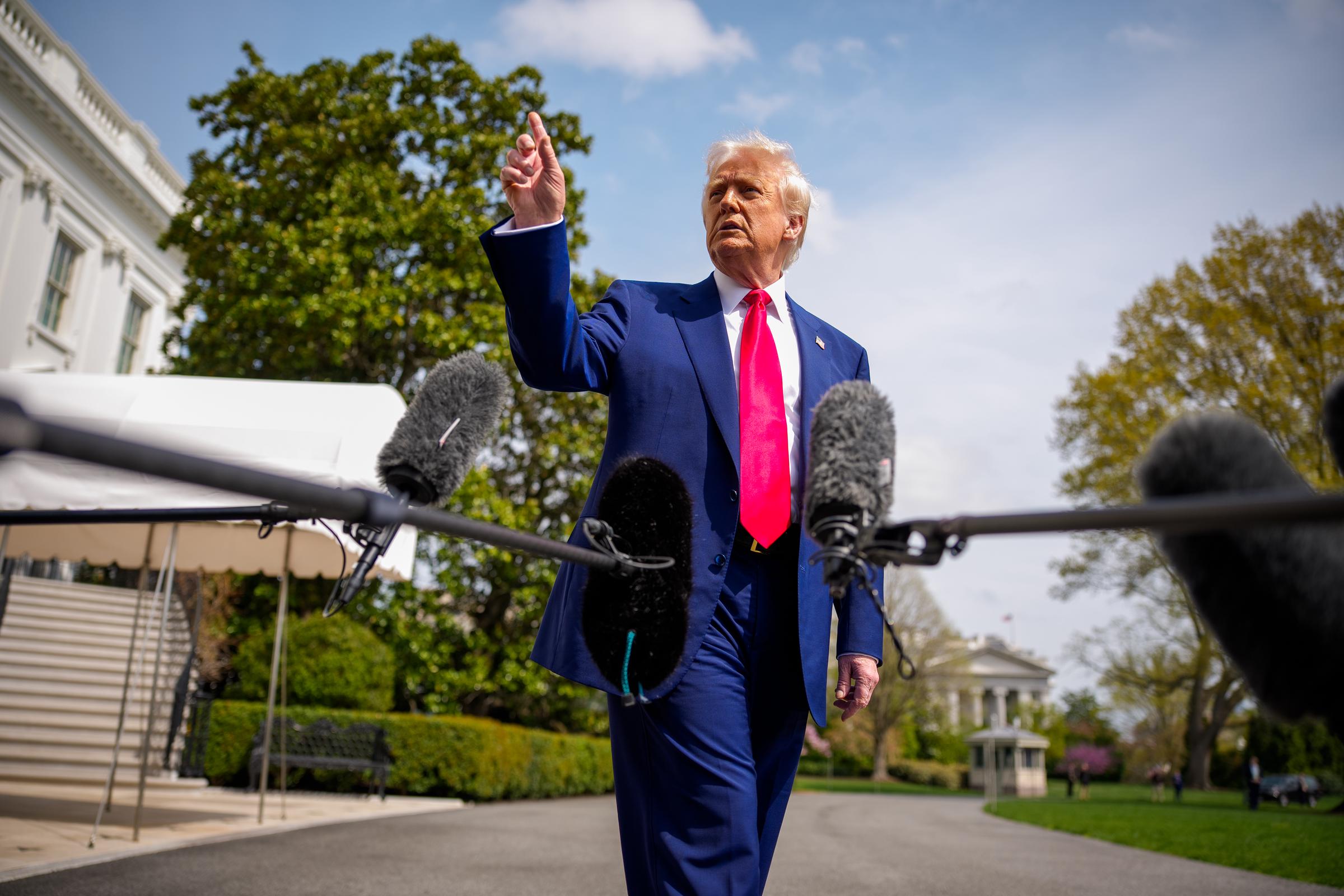 Donald Trump speaks to members of the media before boarding Marine One on the South Lawn of the White House on April 3, 2025 in Washington, DC | Source: Getty Images