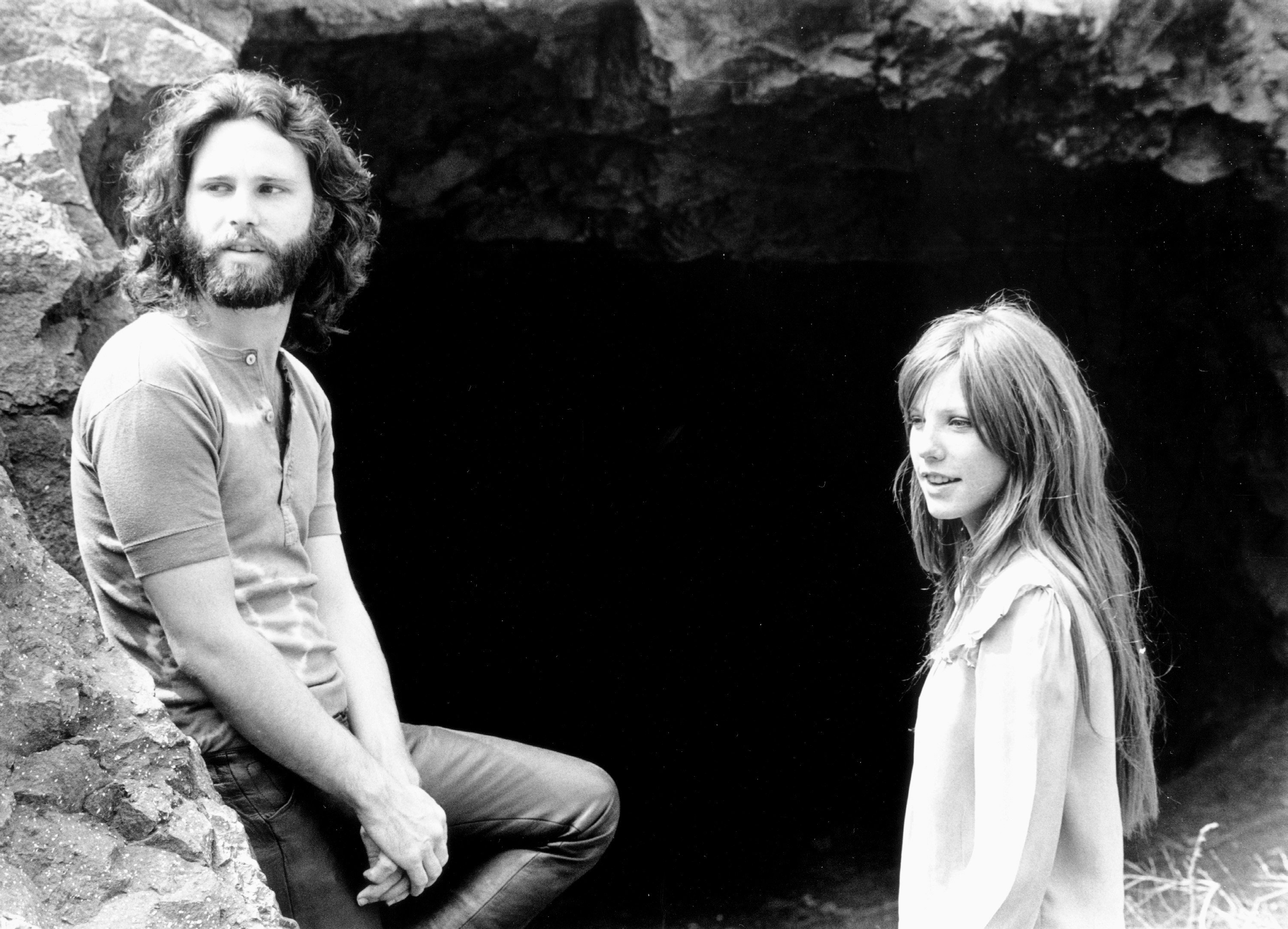  Singer Jim Morrison of The Doors with girlfriend Pamela Courson during a 1969 photo shoot at Bronson Caves in the Hollywood Hills, California. | Source: Getty Images