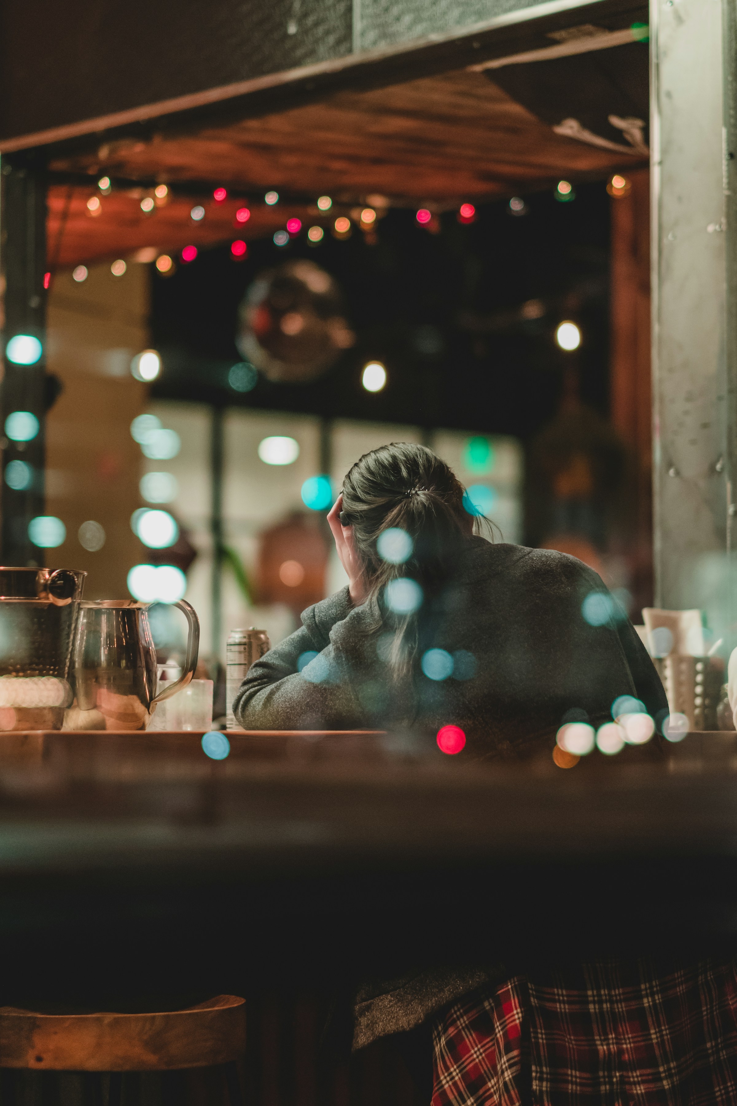 A woman in a coffee shop | Source: Unsplash