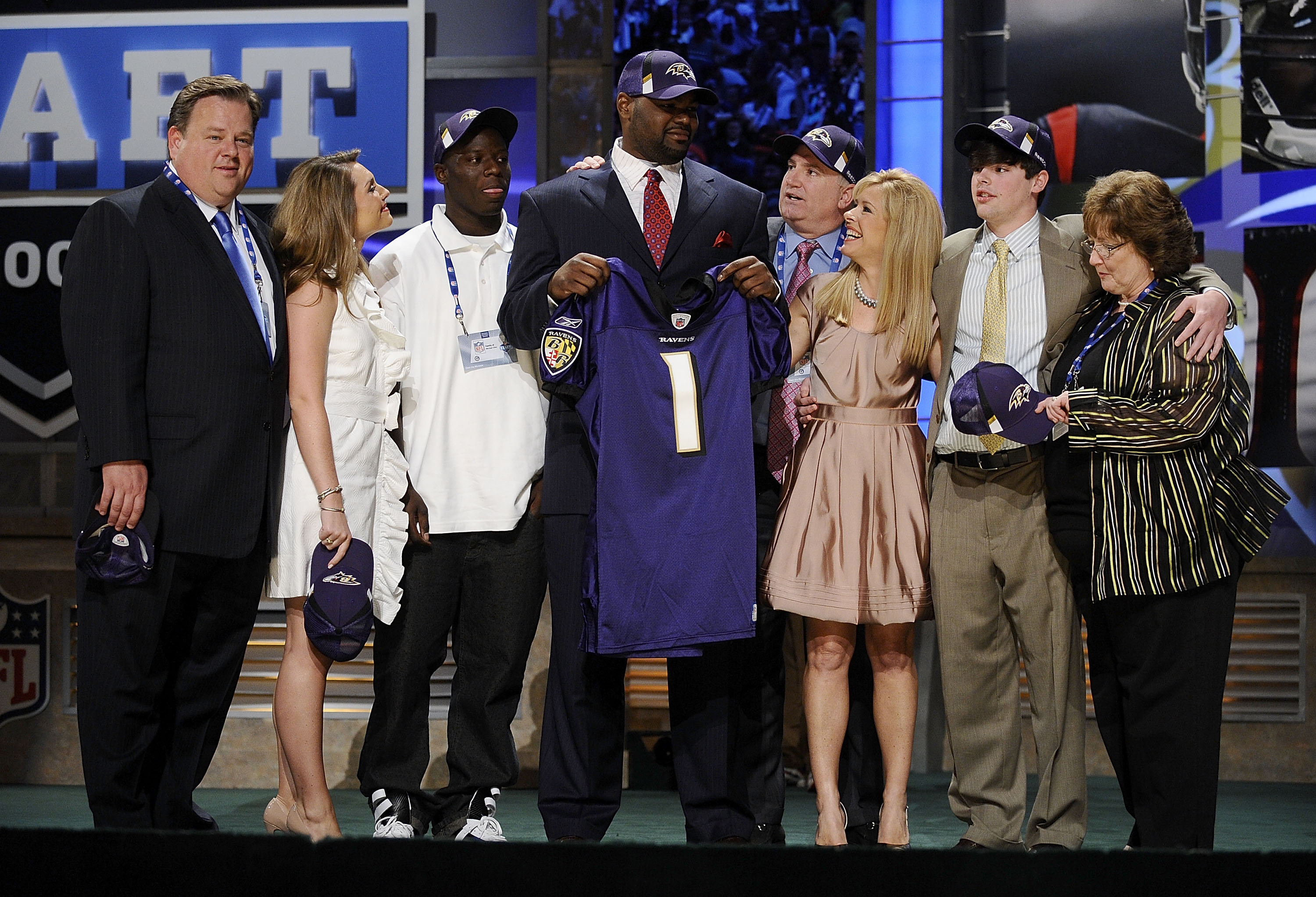 Michael Oher poses for a photograph with the Tuohy family at Radio City Music Hall for the 2009 NFL Draft on April 25, 2009, in New York City. | Source: Getty Images