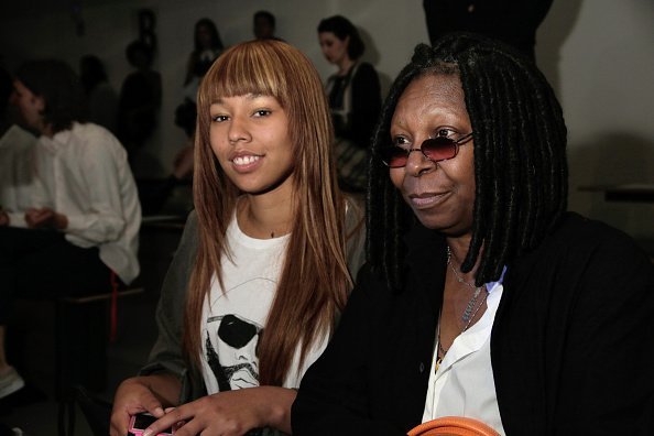 Whoopi Goldberg and her grand daugther Jerzey attend Jeremy Scott's fashion show during MADE Fashion Week Spring 2015 at Milk Studios | Photo: Getty Images