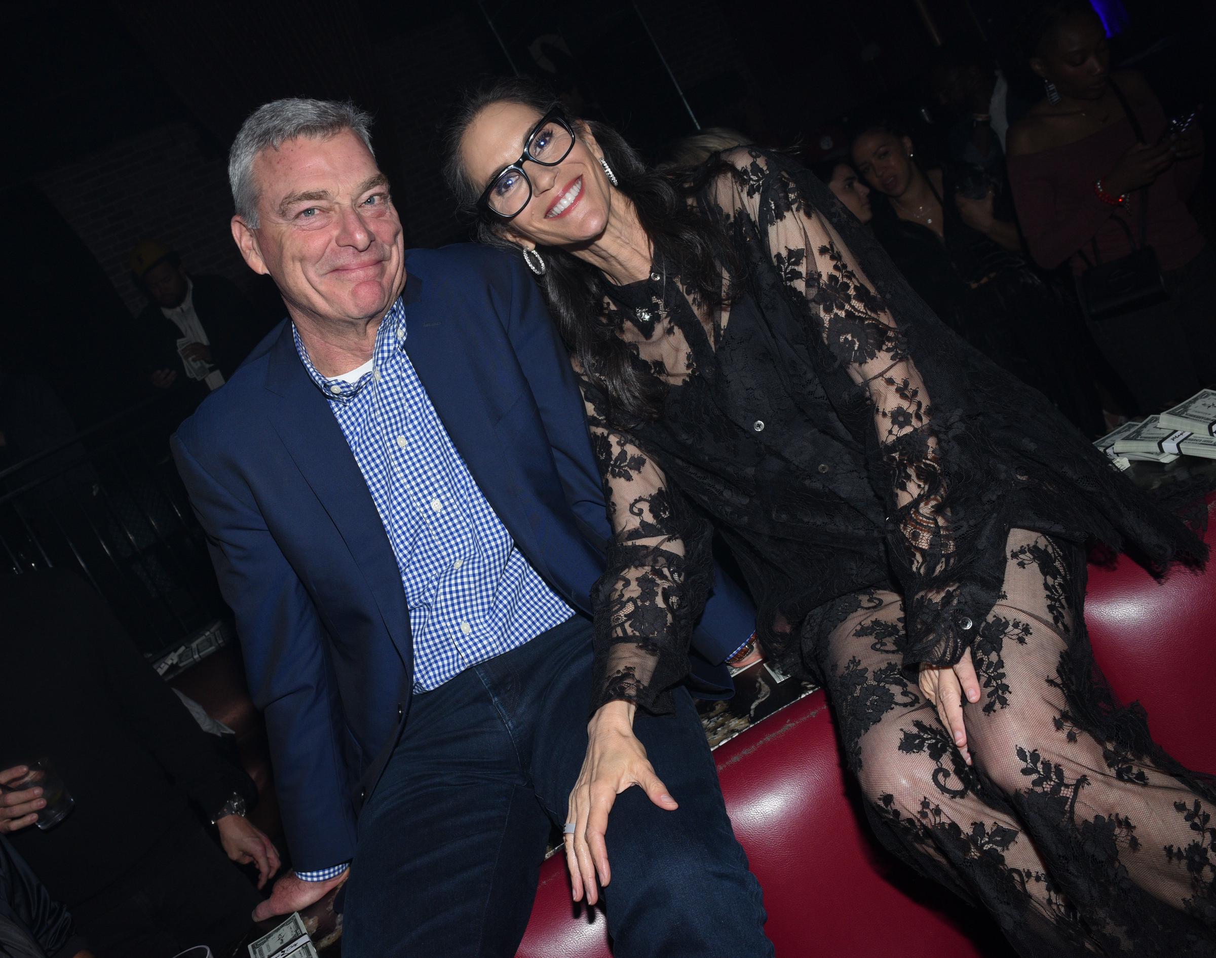 Pictured alongside Tony Ressler, Jami Gertz exuded glamour in a sheer black lace dress at the "Magic City: An American Fantasy" premiere afterparty in Austin.