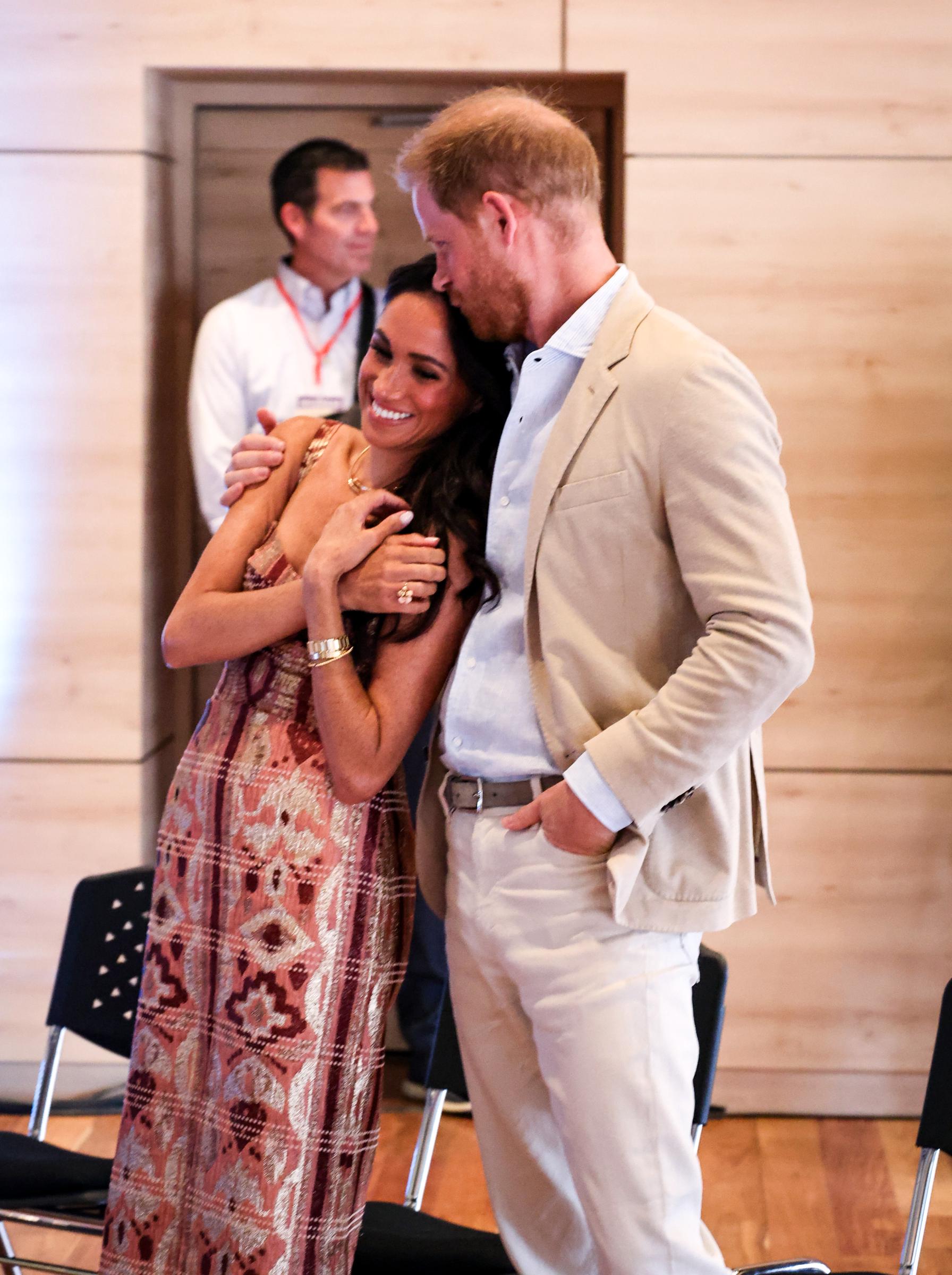 Prince Harry and Meghan Markle sharing a tender embrace in Bogota, Colombia on August 15, 2024. | Source: Getty Images