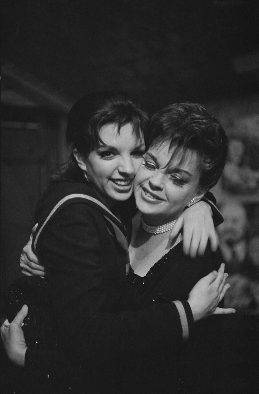 Liza Minnelli with her mother, American actress and singer Judy Garland backstage after she opened in "Flora the Red Menace." | Source: Getty Images