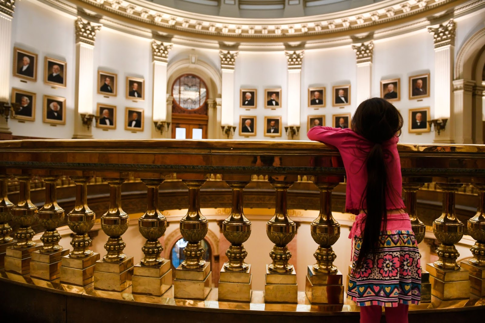 Lily Strickland visits the Colorado State Capitol to look at the portraits of the U.S.' presidents that line the walls on the third floor on March 27, 2017, in Denver, Colorado | Source: Getty Images