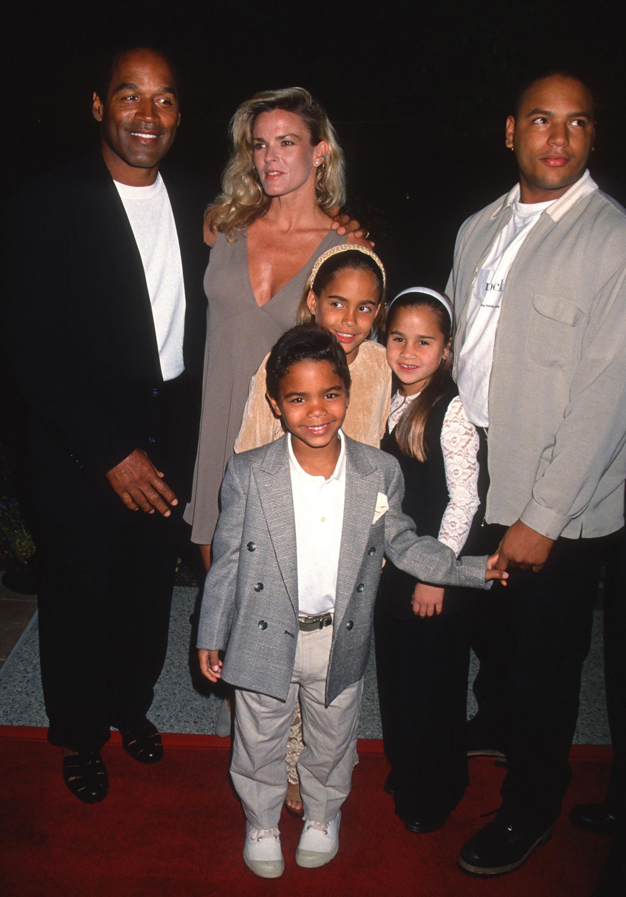 O.J. Simpson and his wife, Nicole Brown Simpson along with their children Justin, Sydney, and Jason, attend a screening of "Naked Gun 33 1/" on March 16, 1994, in Hollywood, California. | Source: Getty Images