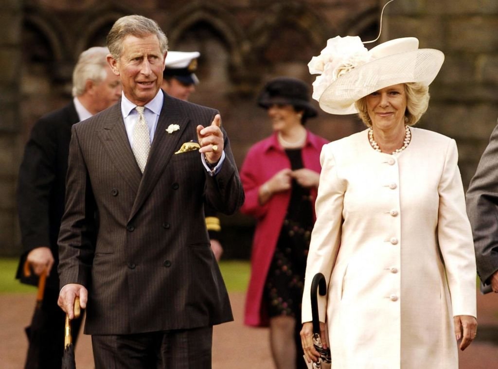 Prince Charles and Camilla Parker-Bowles during a garden party at the Palace of Holyroodhouse in Edinburgh. | Source: Getty Images