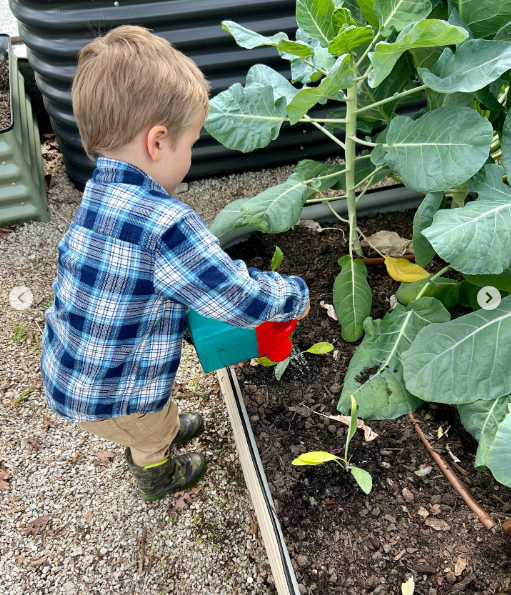 Carrie Underwood's son watering the garden, dated April 2023 | Source: Instagram/carrieunderwood