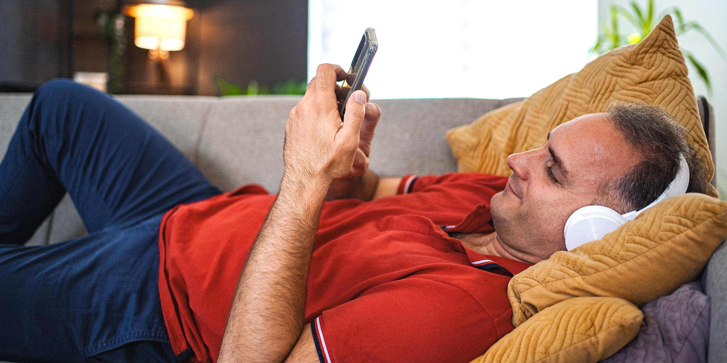 A man relaxing on the sofa | Source: Shutterstock