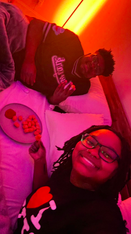 Marquay and Khris Collins sharing some food together and smiling for a photo. | Source: Facebook/Khris Collins