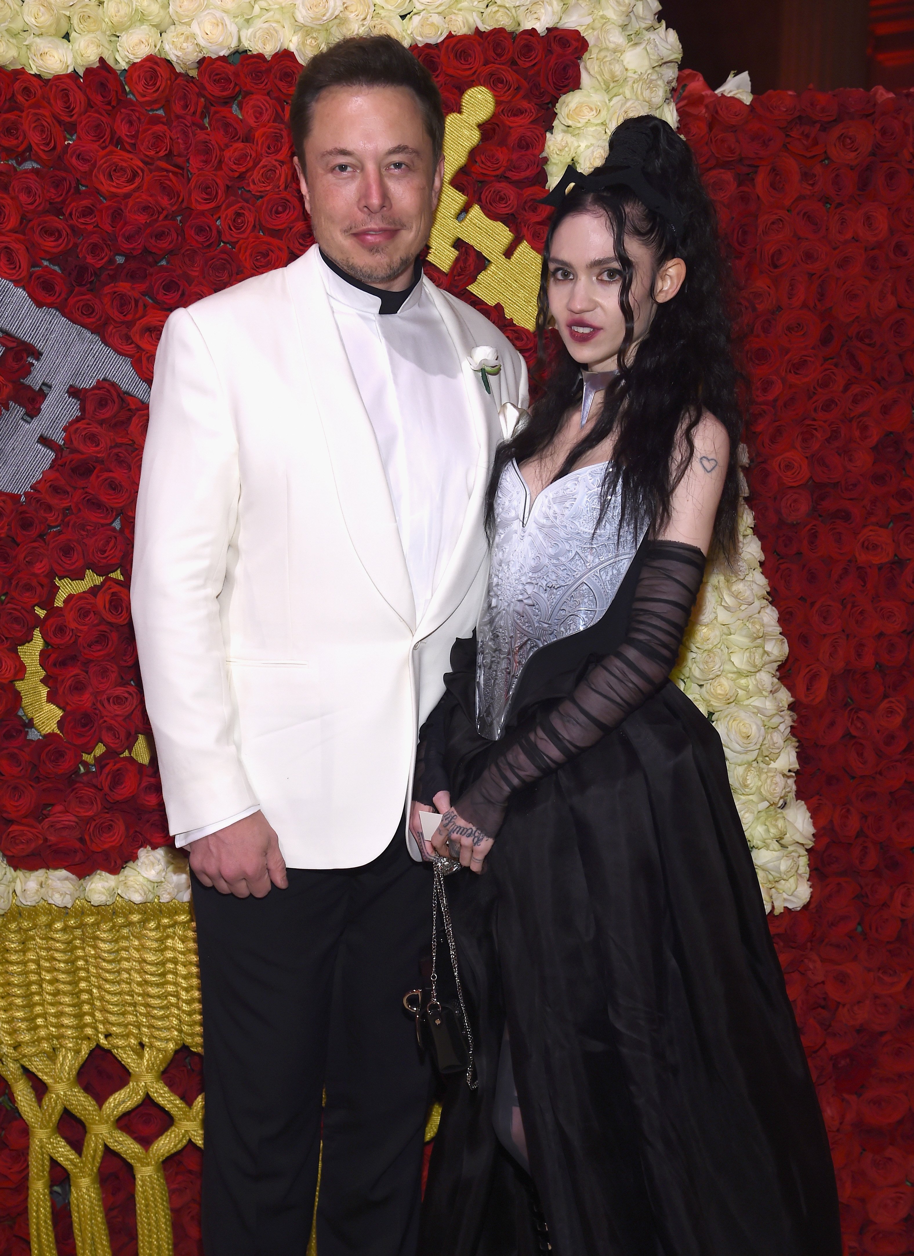 Elon Musk and Grimes attend the Heavenly Bodies: Fashion & The Catholic Imagination Costume Institute Gala at The Metropolitan Museum of Art on May 7, 2018 in New York City. | Source: Getty Images