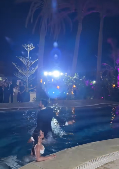The moment the groom jumped into the pool, from a July 2025 video post | Source: TikTok/emadjoe1