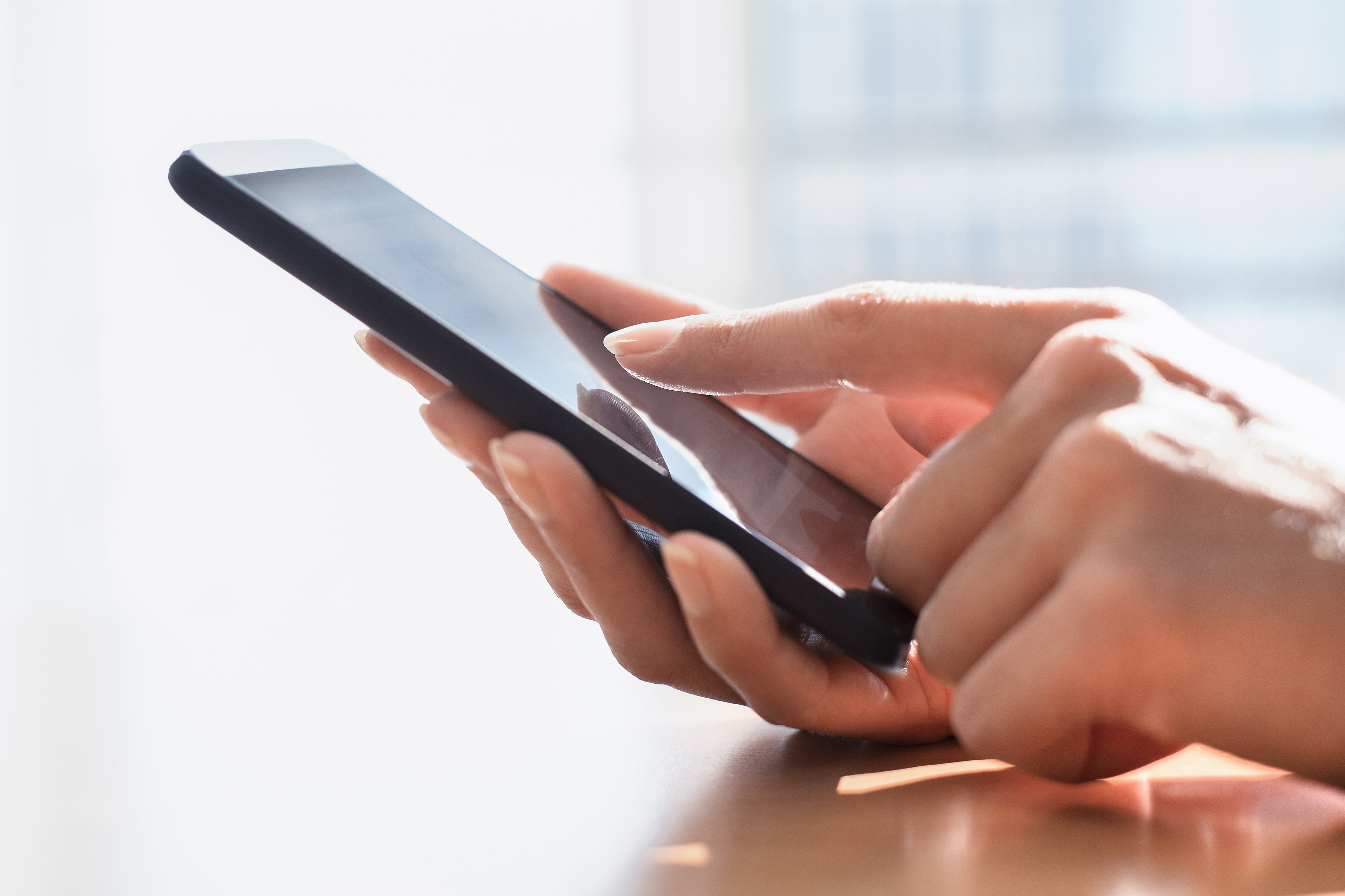 Phone in arms | Source: Shutterstock