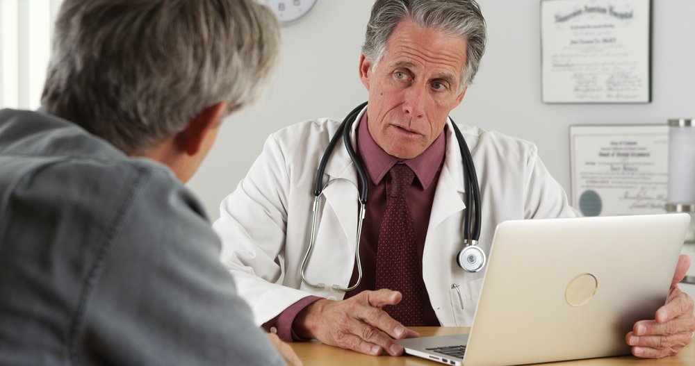 Senior man with medical doctor. | Source: Shutterstock