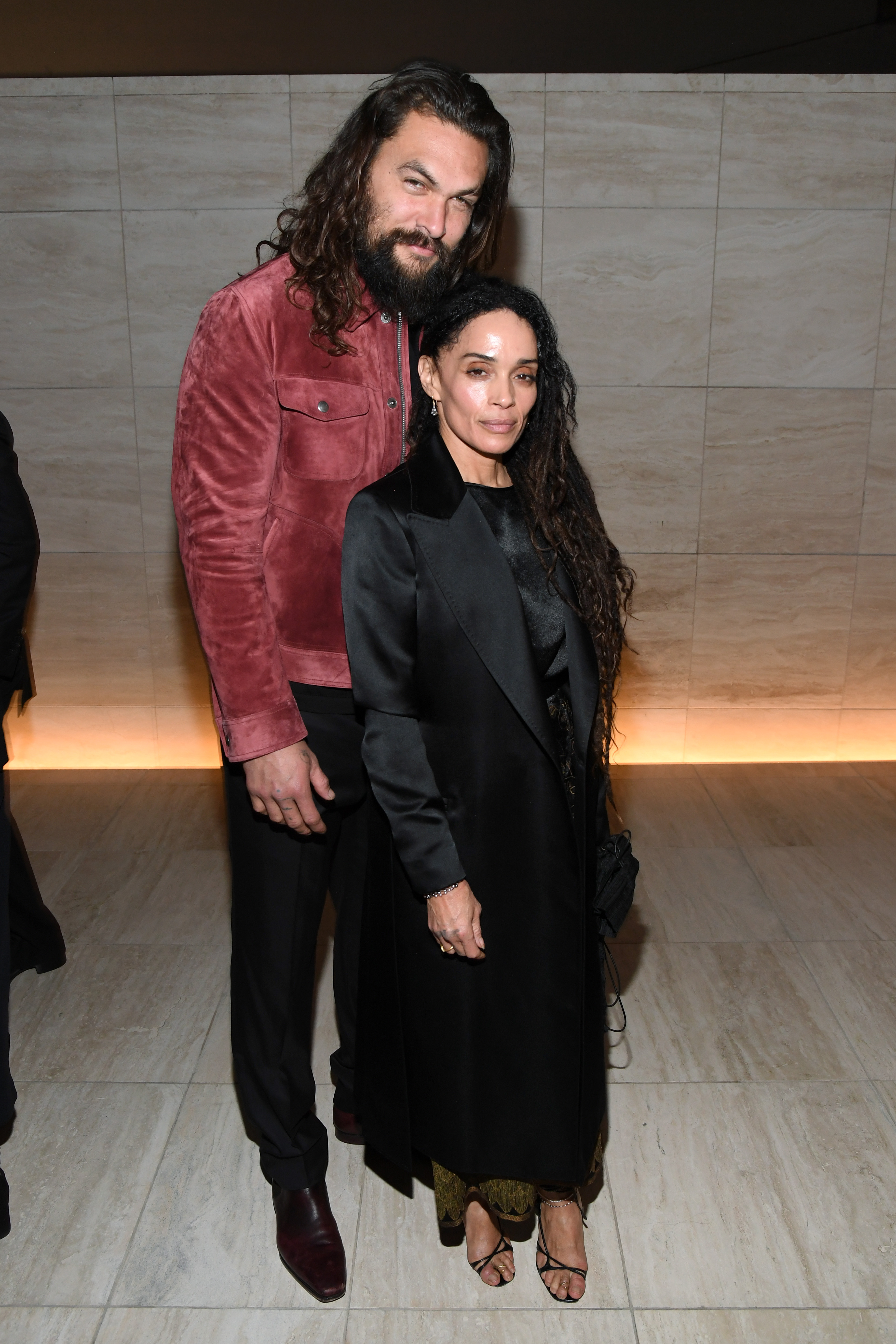 Jason Momoa and Lisa Bonet posing for pictures at the Tom Ford AW20 Show at Milk Studios. | Source: Getty Images