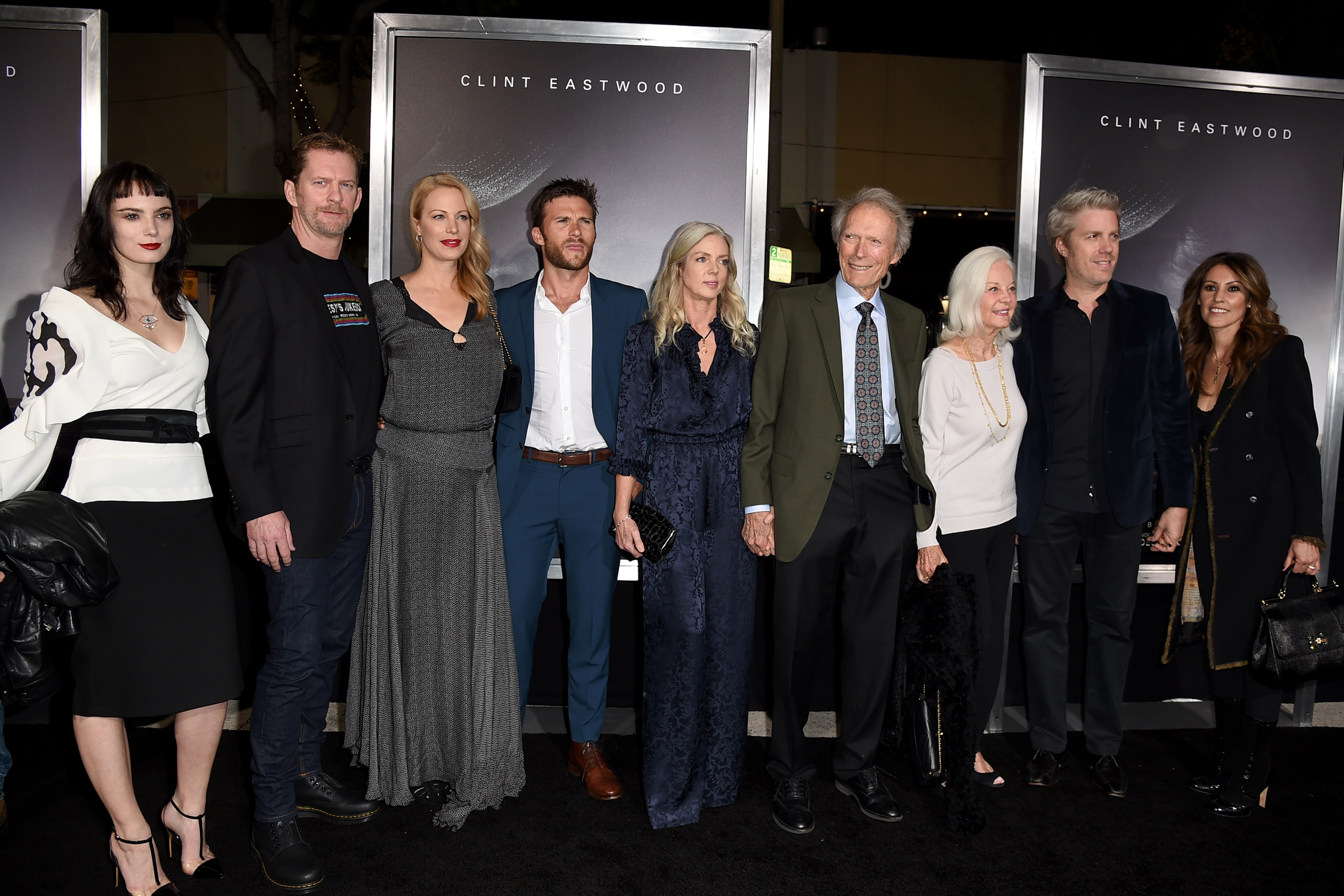 (L-R) Graylen Eastwood, Stacy Poitras, Alison Eastwood, Scott Eastwood, Christina Sandera, Clint Eastwood, Maggie Johnson, Kyle Eastwood and Cynthia Ramirez pose at the premiere of Warner Bros. Pictures' "The Mule,"  2018 | Source: Getty Images