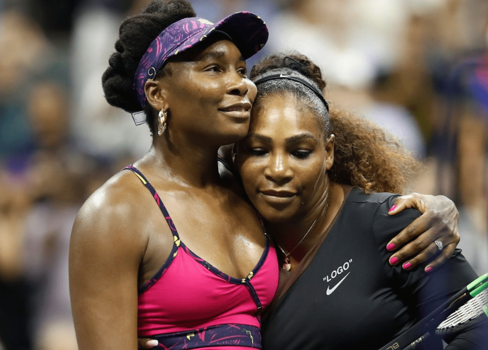 Serena Williams and sister Venus Williams share a hug after their third round match in the US Open on August 2018. | Source: Getty Images