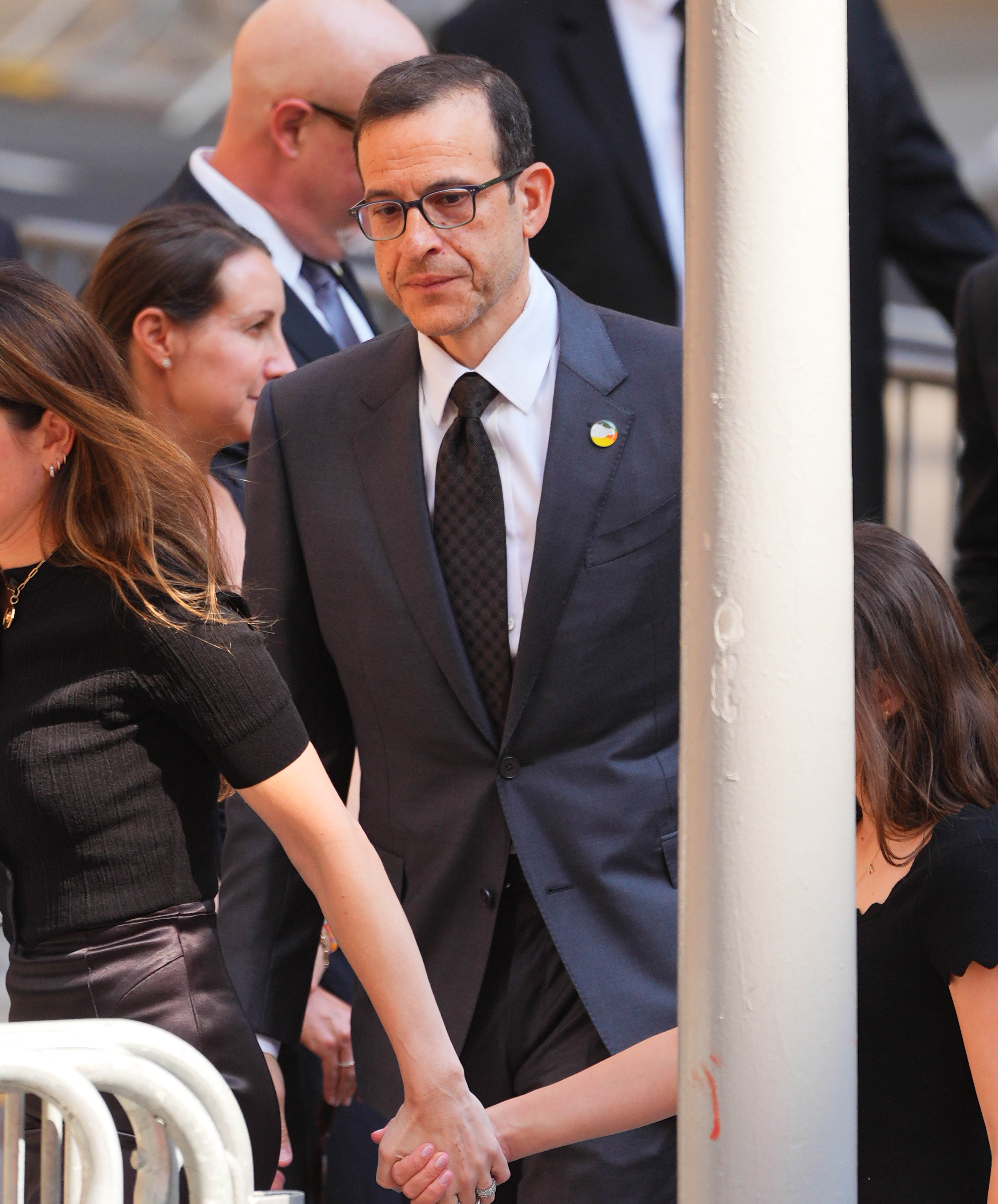 Doug Davis, one of Clive Davis' sons and CEO of Sony Music Publishing, greeted family friends and industry colleagues as they arrived at Central Synagogue for the memorial service honoring his father. | Source: Getty Images