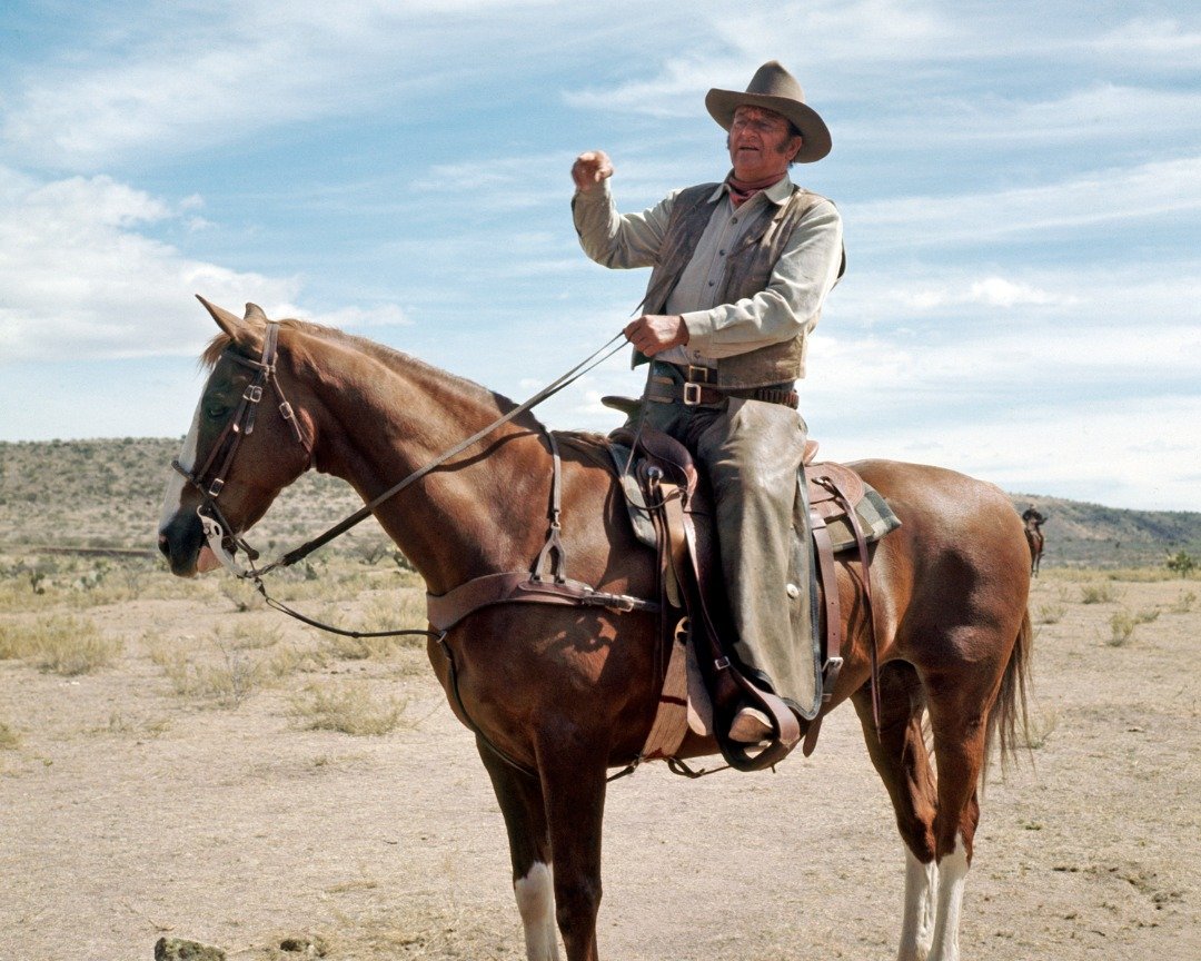 American actor John Wayne on horseback in a scene from the film 'Chisholm' in 1970. | Source: Getty Images