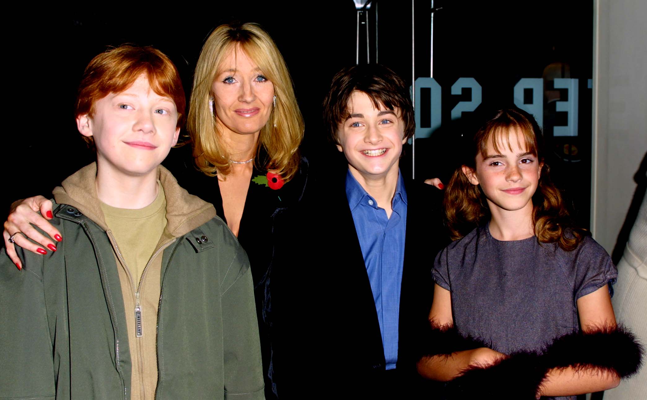 Actors Rupert Grint, Author JK Rowling, Daniel Radcliffe and Emma Watson attend the world premiere of the first Harry Potter film, 'Harry Potter and the Philosopher's Stone' at the Odeon Leicester Square, London, November 4, 2001. | Source: Getty Images